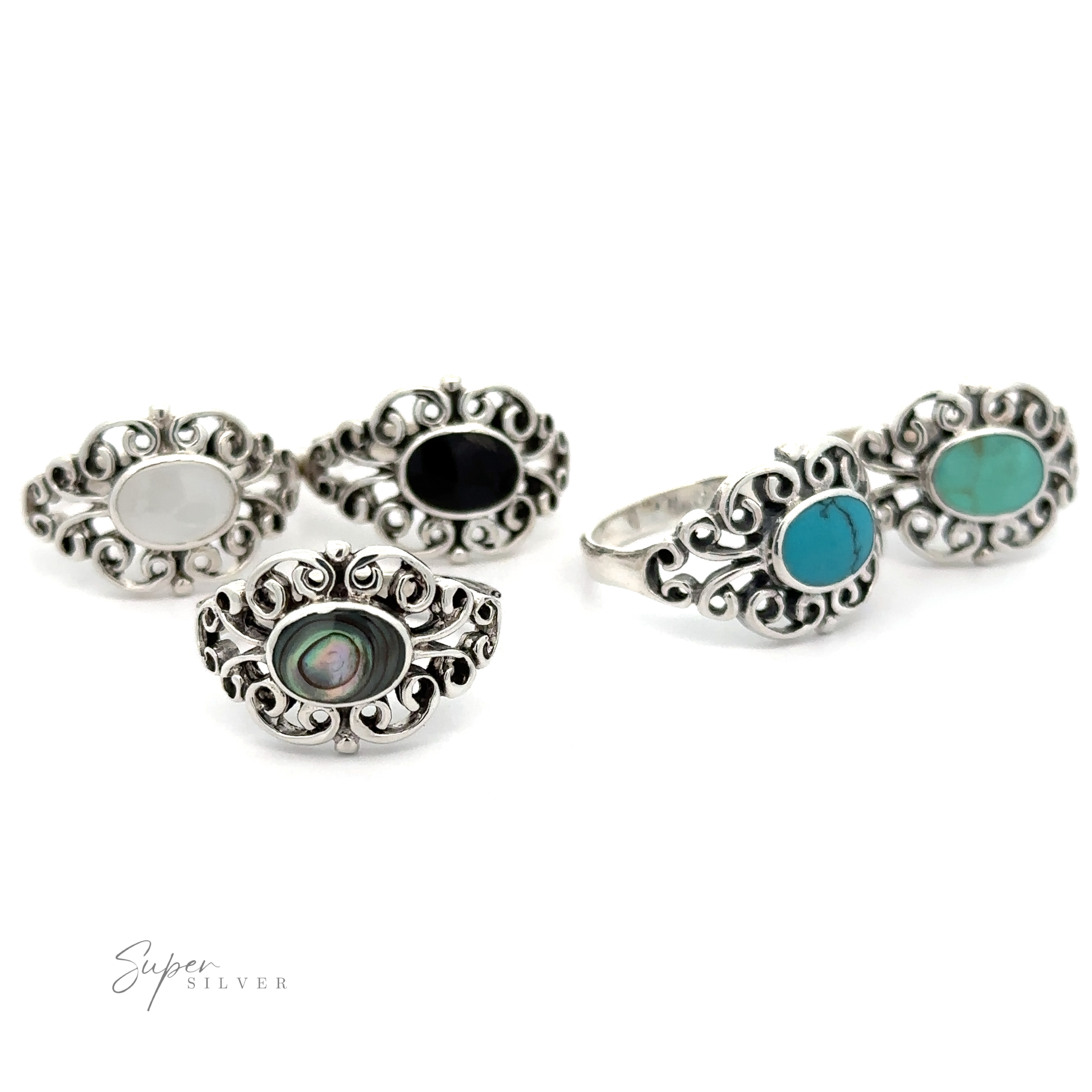 A vintage pair of Victorian Filigree Inlay Stone Rings with black and turquoise stones.