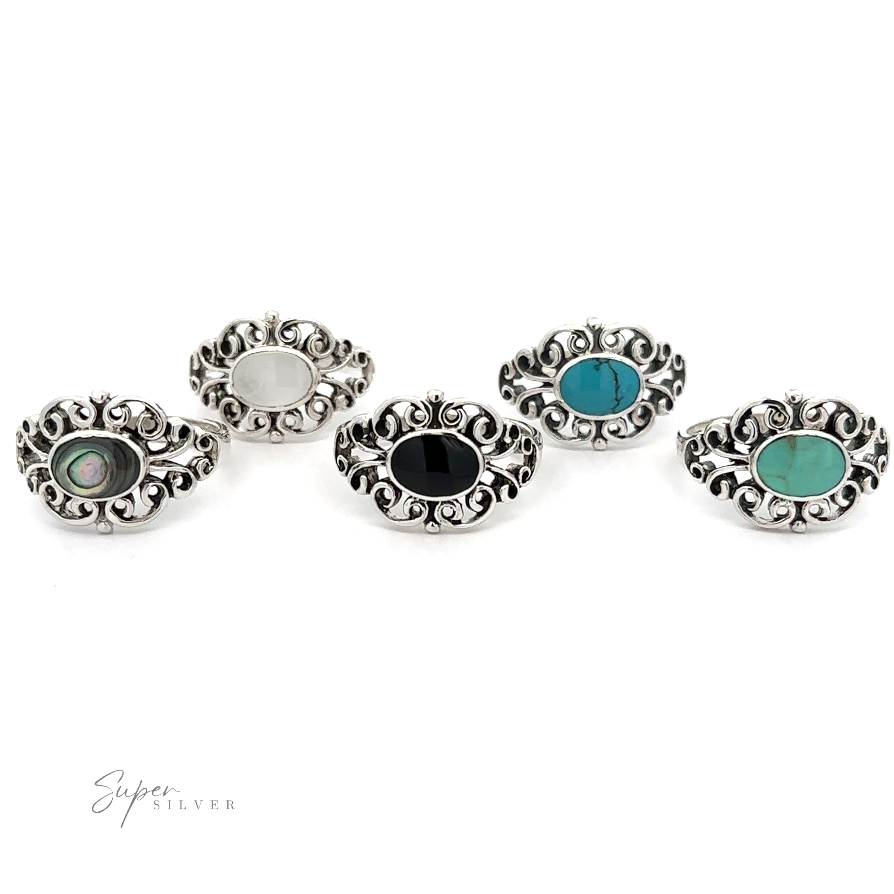 A set of four elegant Victorian Filigree Inlay Stone Rings with timeless colored stones.
