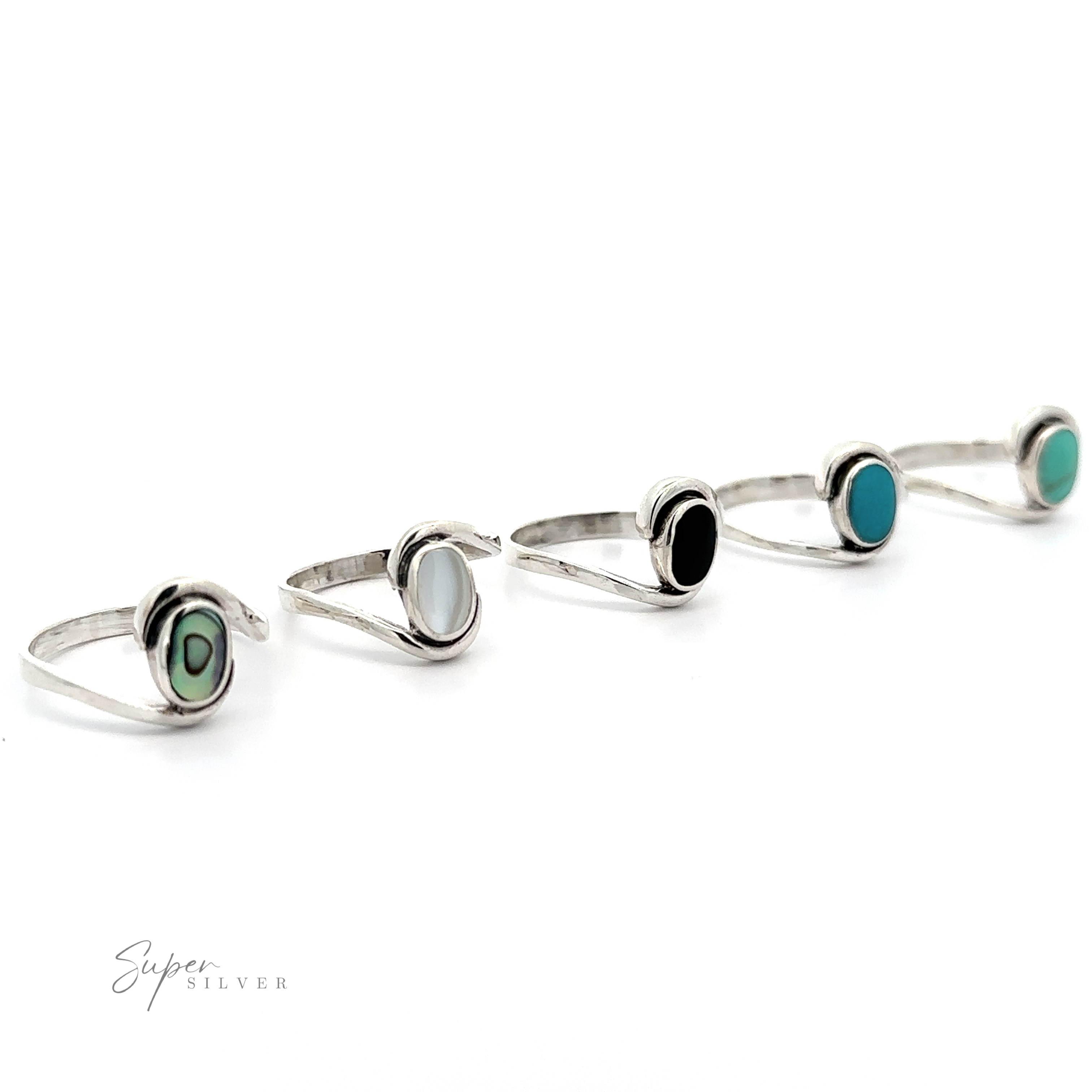 A row of Simple Freeform Rings with Oval Inlaid Stones.