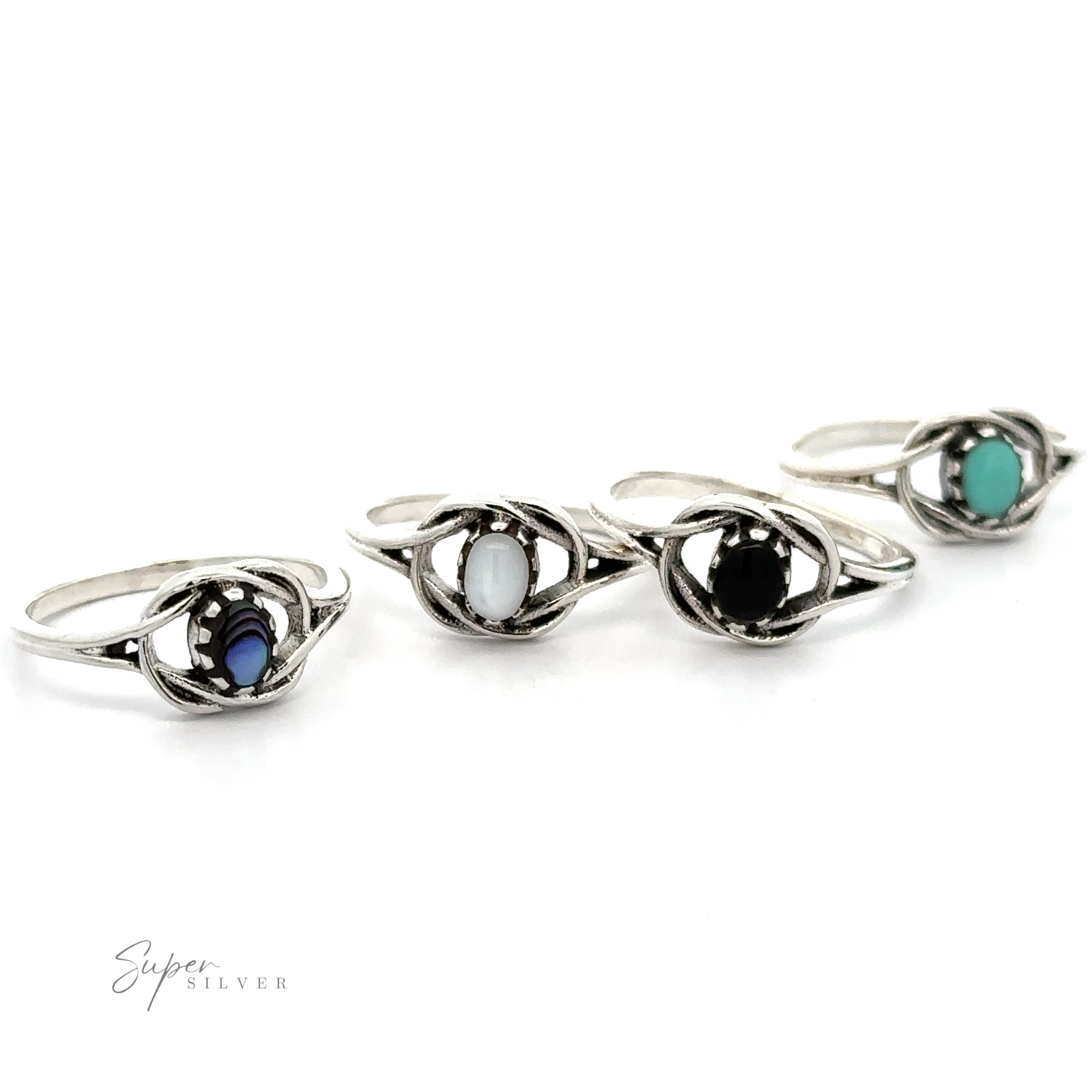 A group of Delicate Knot Rings with Oval Stone in different colors with a boho vibe.