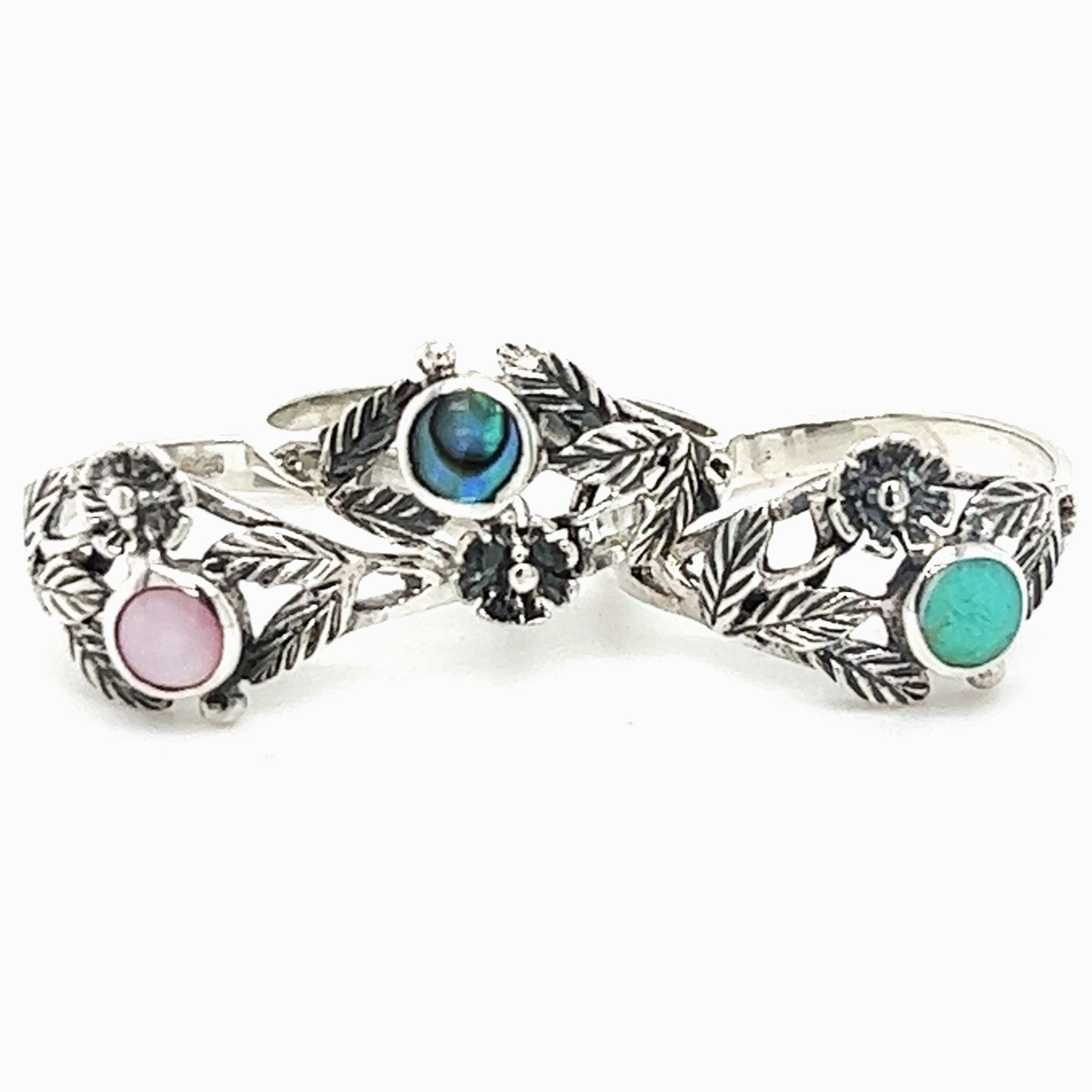 A close up of an Inlaid Stone Ring with Dainty Flower.