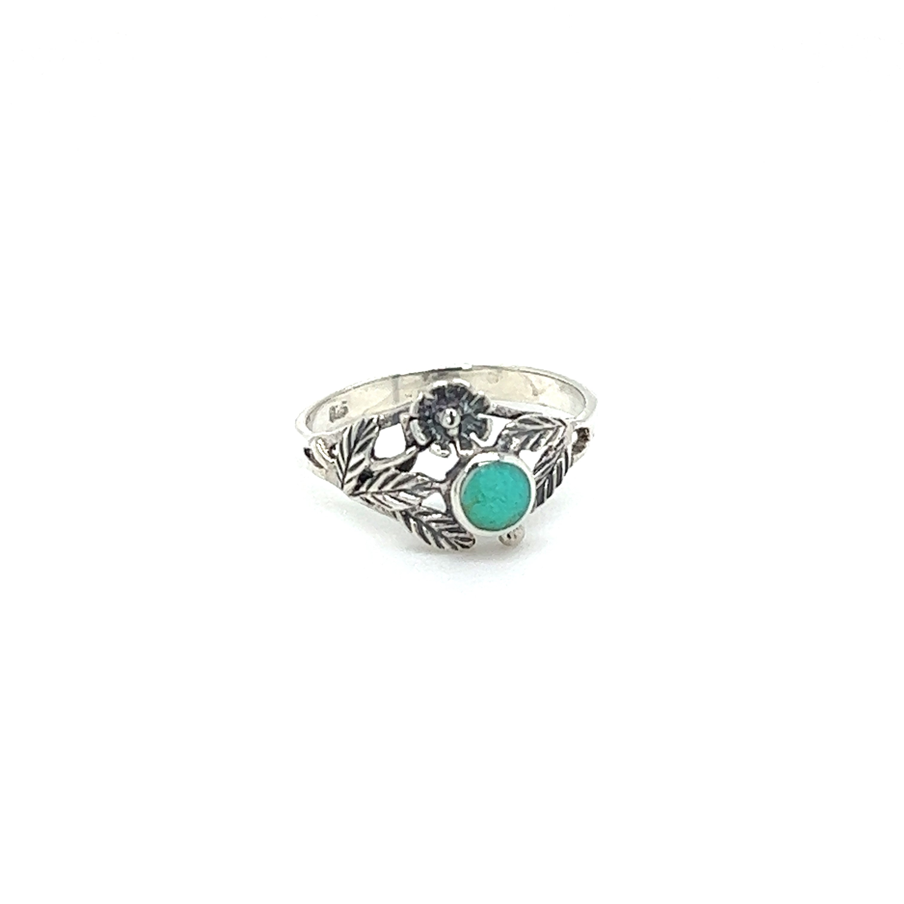 A vintage-inspired Super Silver ring with a Inlaid Stone Ring with Dainty Flower and turquoise stone.