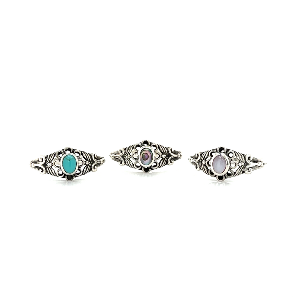 Three Oval Flower Rings with Inlay Stones on a white background by Super Silver.