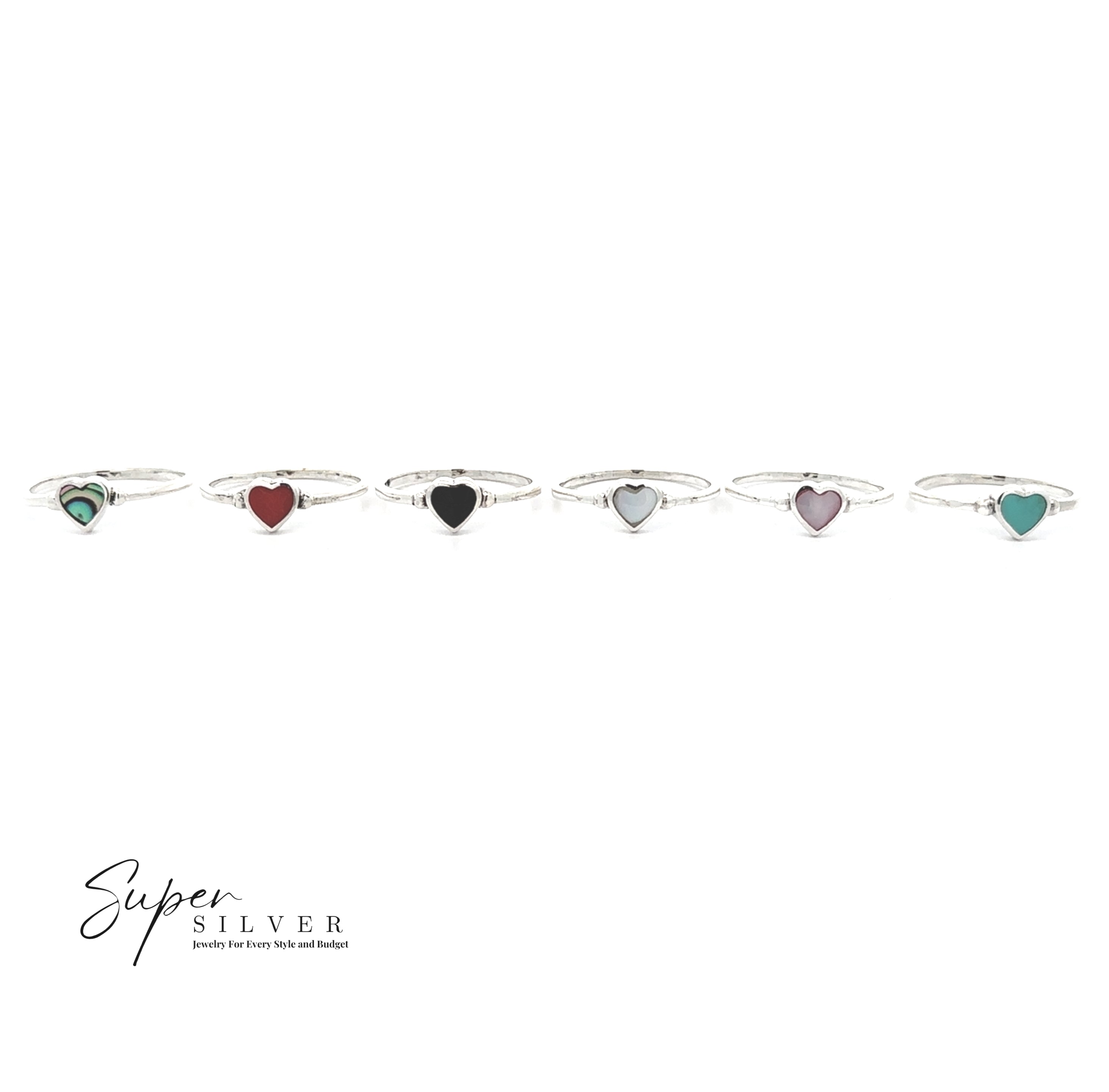 Six Dainty Inlaid Heart Rings with heart-shaped stones in various colors are displayed in a row on a white background. The "Super Silver" logo appears at the bottom left corner.