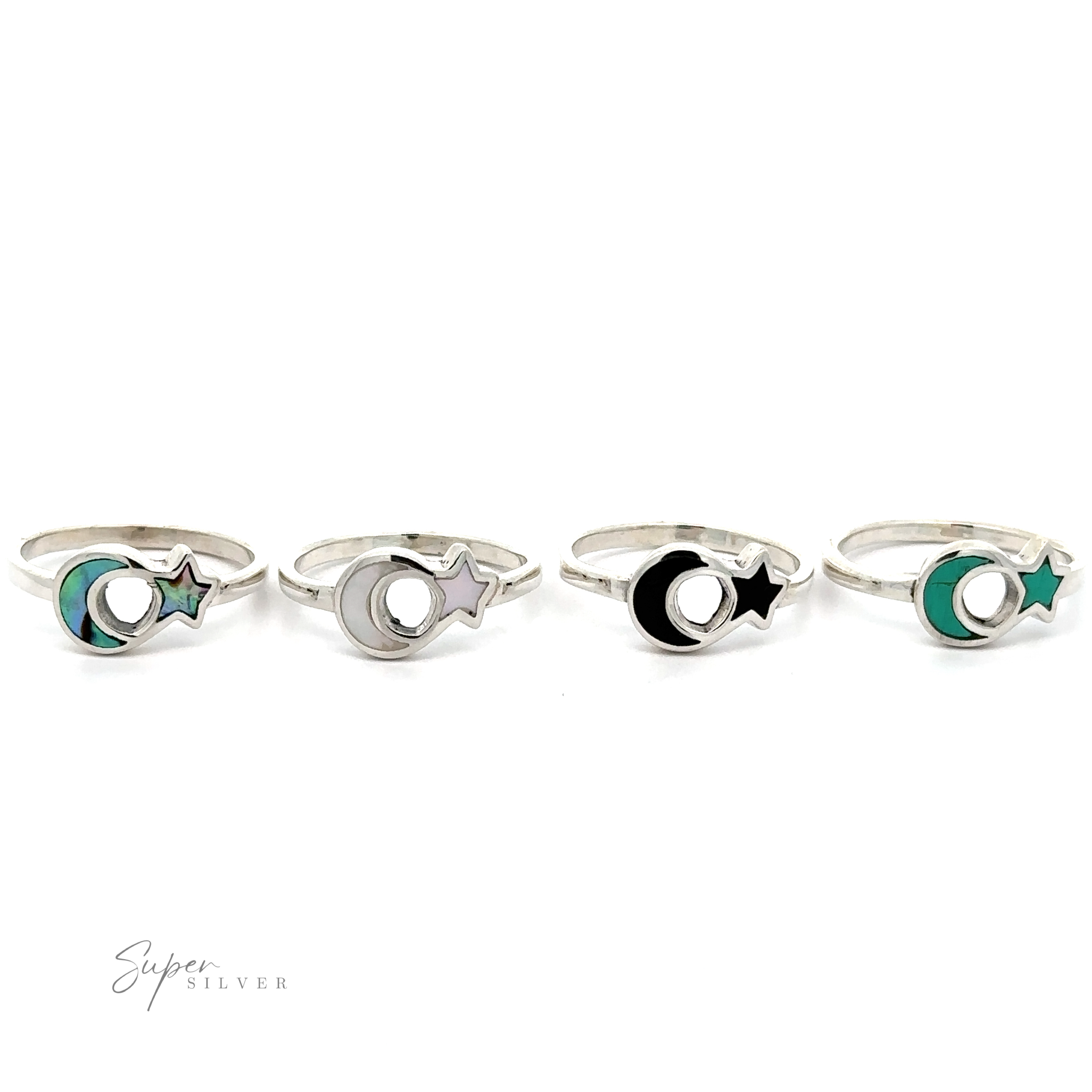 Four Crescent Moon And Star Rings with Inlaid Stones, displayed in a row against a white background.