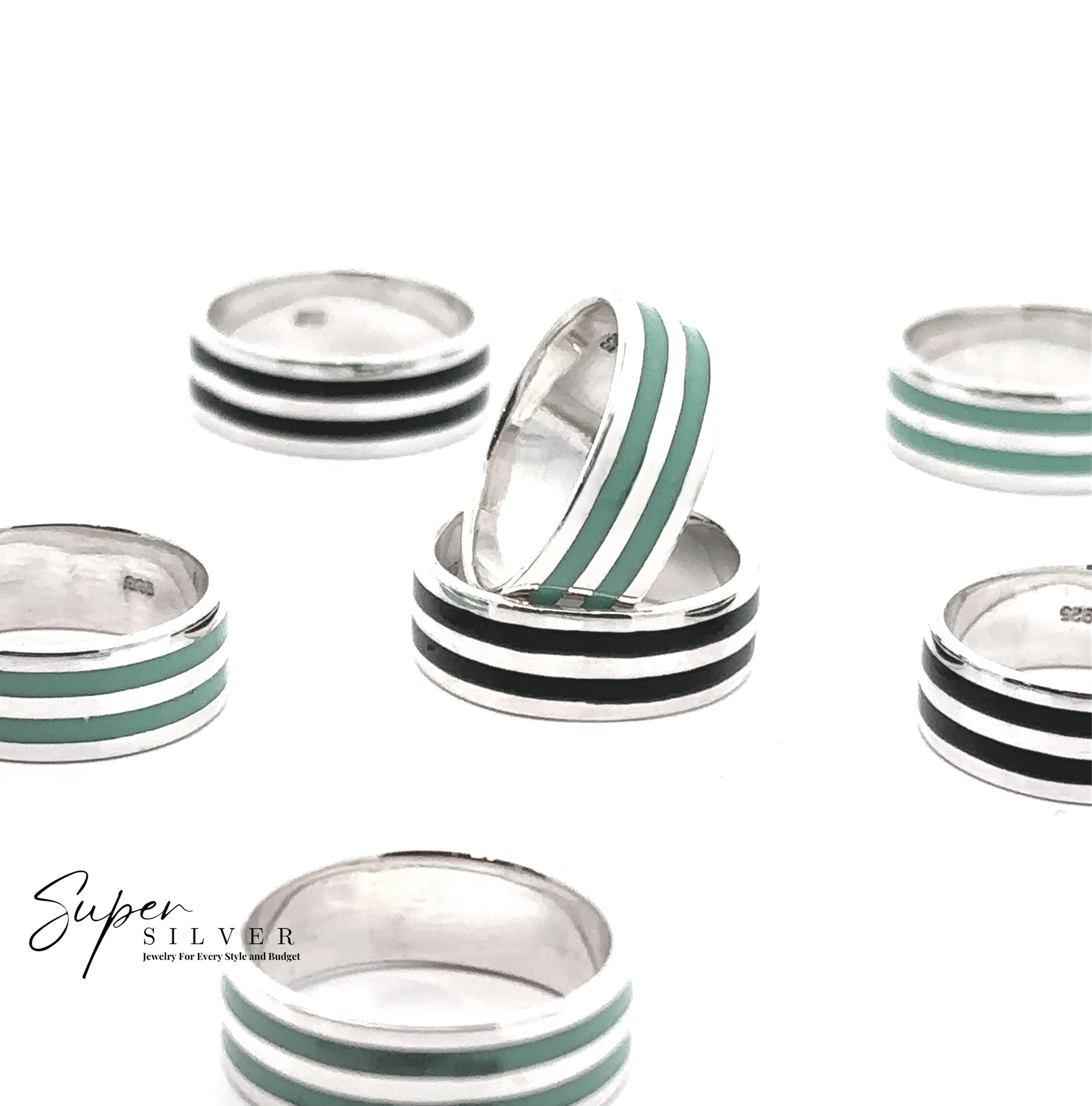 The Double Stripe Inlay Band, featuring black and teal enamel stripes on sterling silver, is displayed on a white background with the "Super Silver" logo in the lower left corner.