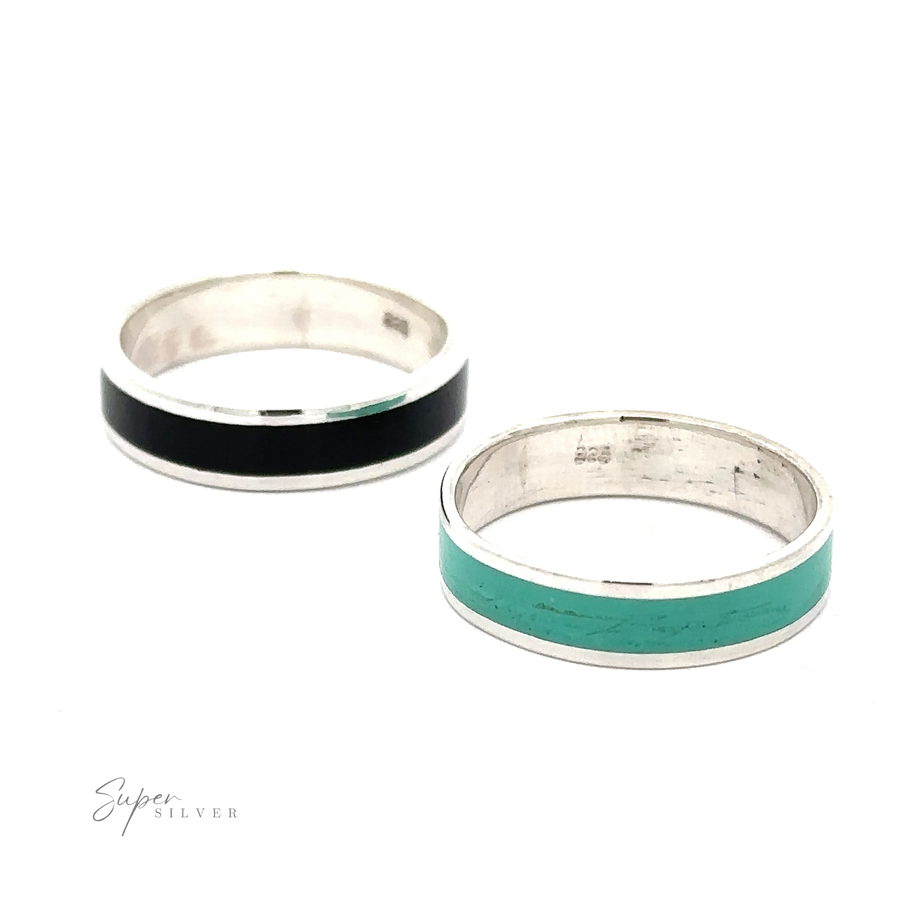 Two sterling silver rings are displayed on a white background. One features a black stripe, the other a turquoise stripe, reflecting minimalist design. The text "Simple Inlay Band" appears elegantly in the bottom left corner.
