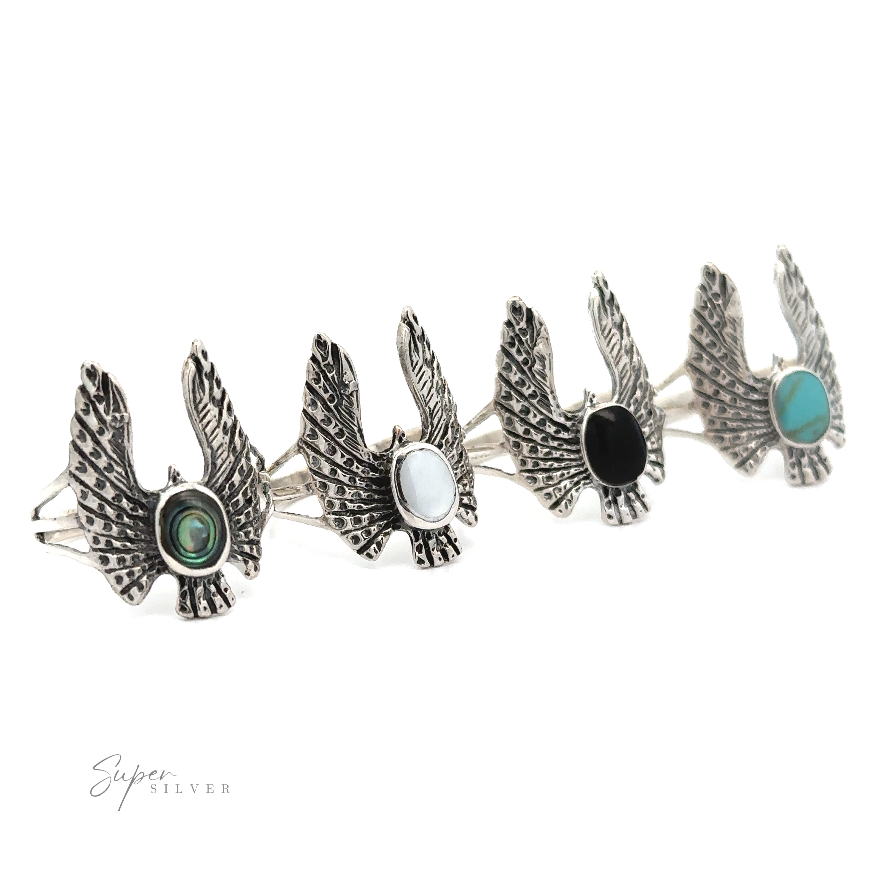 Experience the charm of the Inlaid Stone Ring with Eagle Wings, made from .925 Sterling Silver and featuring uniquely colored stones in green, white, black, and turquoise. Ideal for those who appreciate the free-spirited elegance of bohemian fashion.