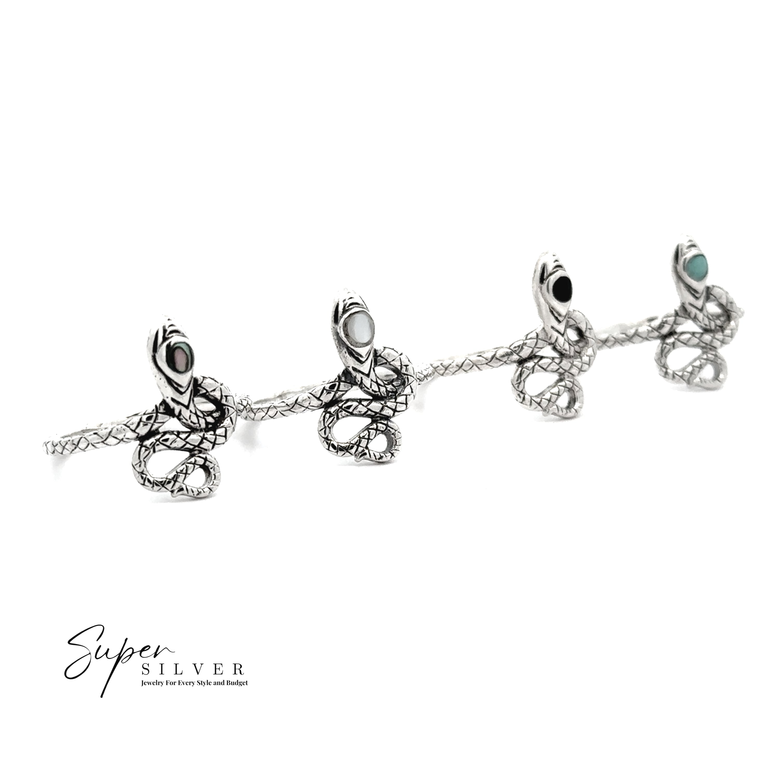Four Coiled Snake Rings with Inlaid Stone are displayed in a row on a white background. The "Super Silver" logo appears in the bottom left corner, showcasing this unique transformation jewelry collection.
