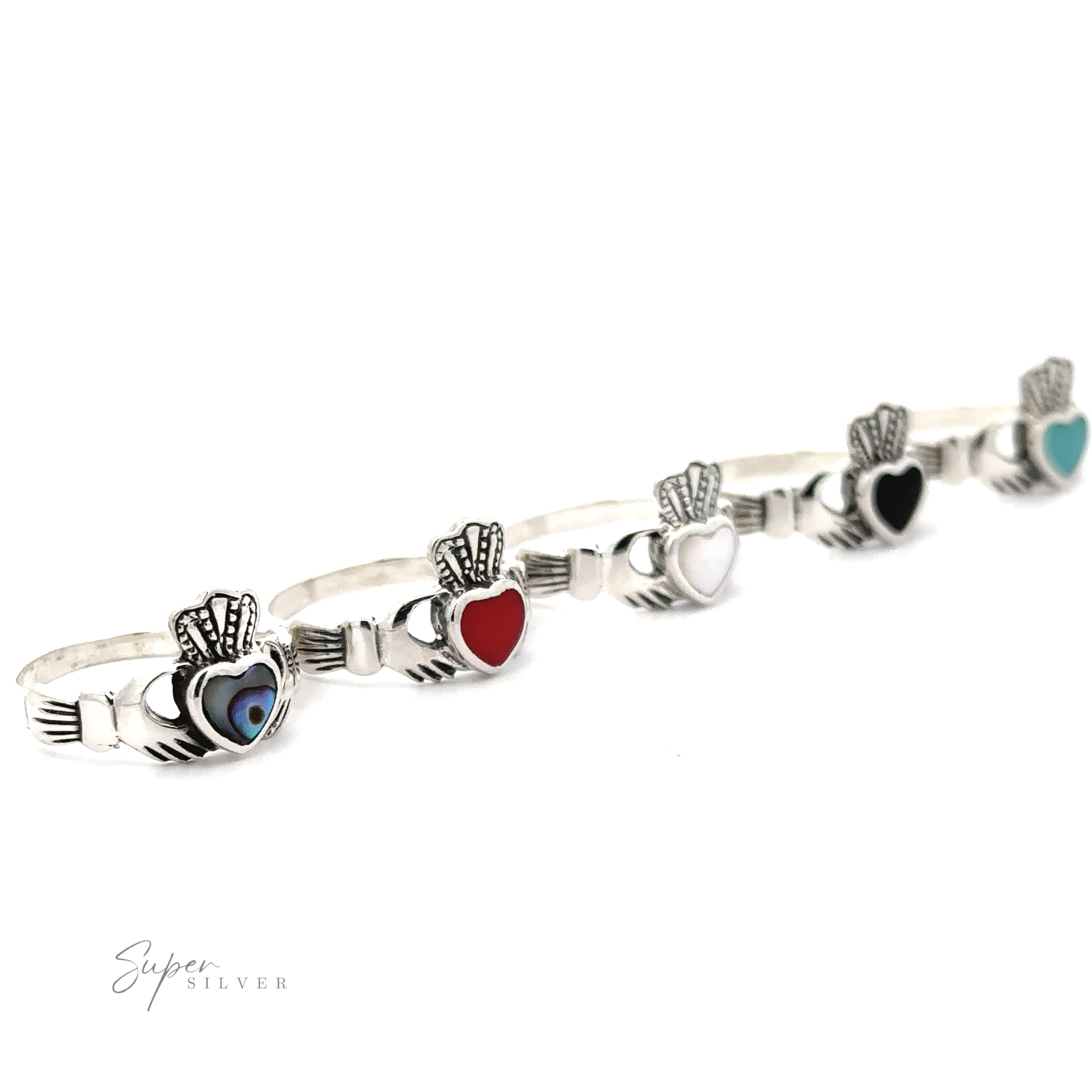 A silver bracelet inspired by the Claddagh Inlaid Stone Ring, featuring decorative hands with heart-shaped and variously colored gems in the palms, displayed on a white background.
