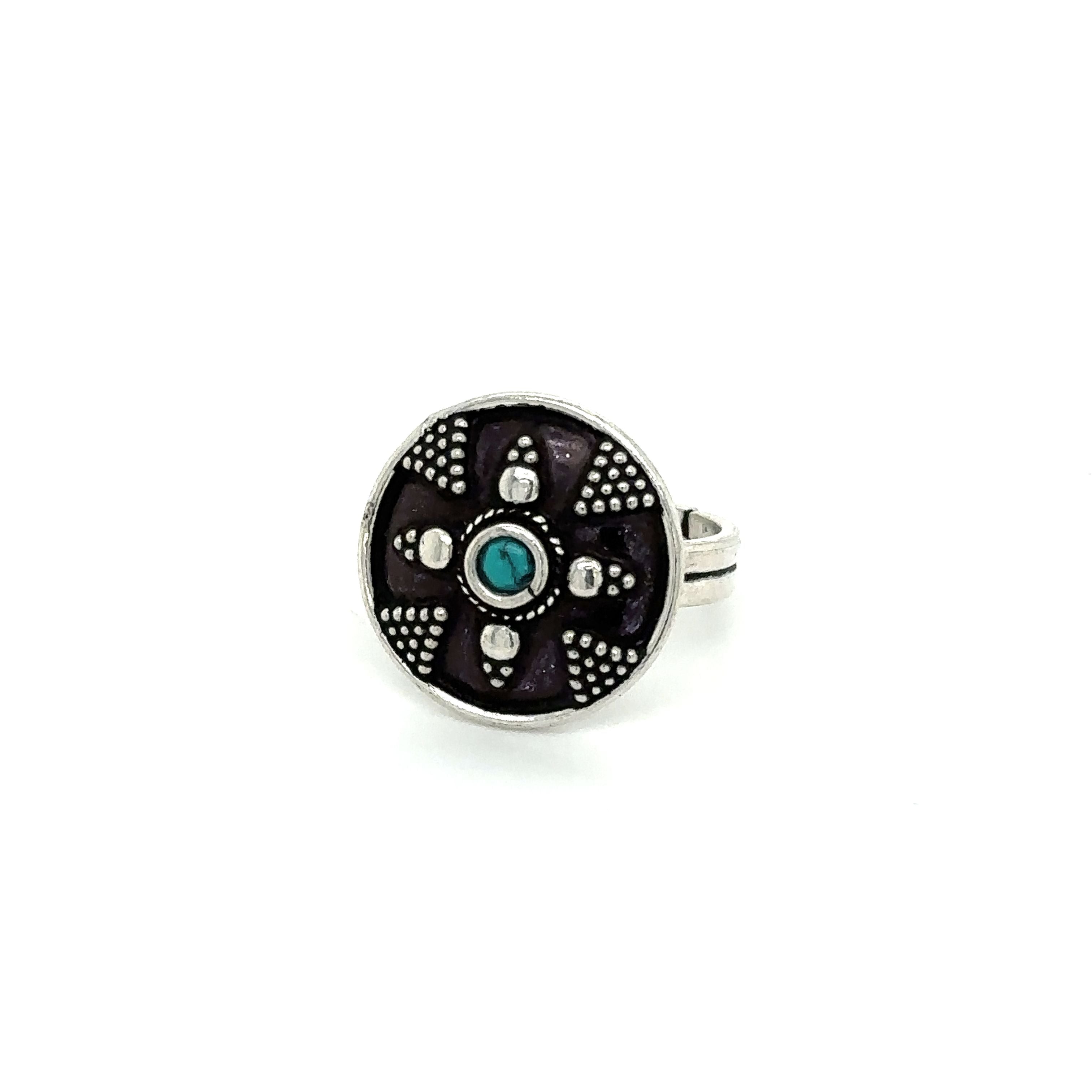 A stunning Tibetan-Style ring adorned with small turquoise stones.