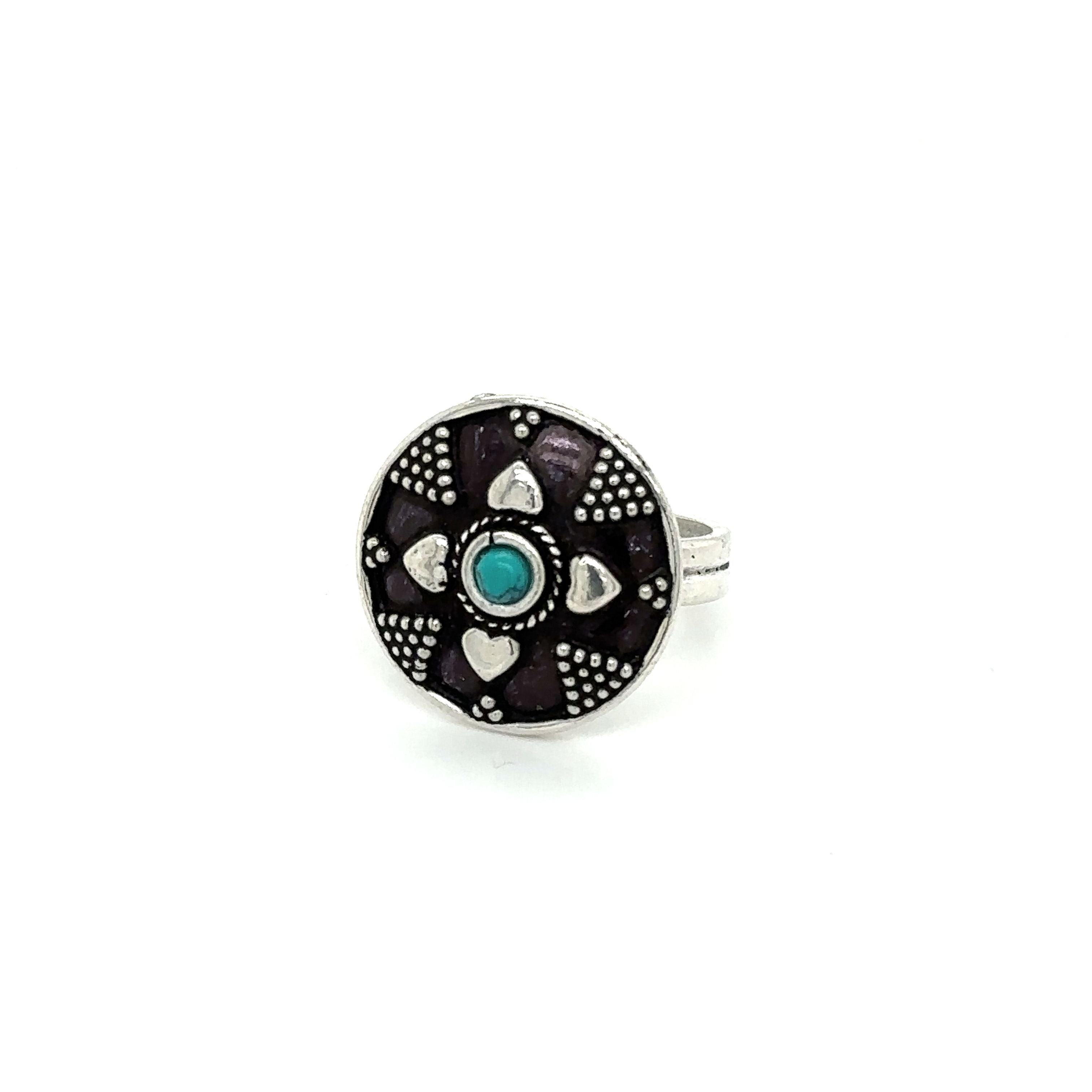 A stunning Tibetan-Style Ring with a small turquoise stone.