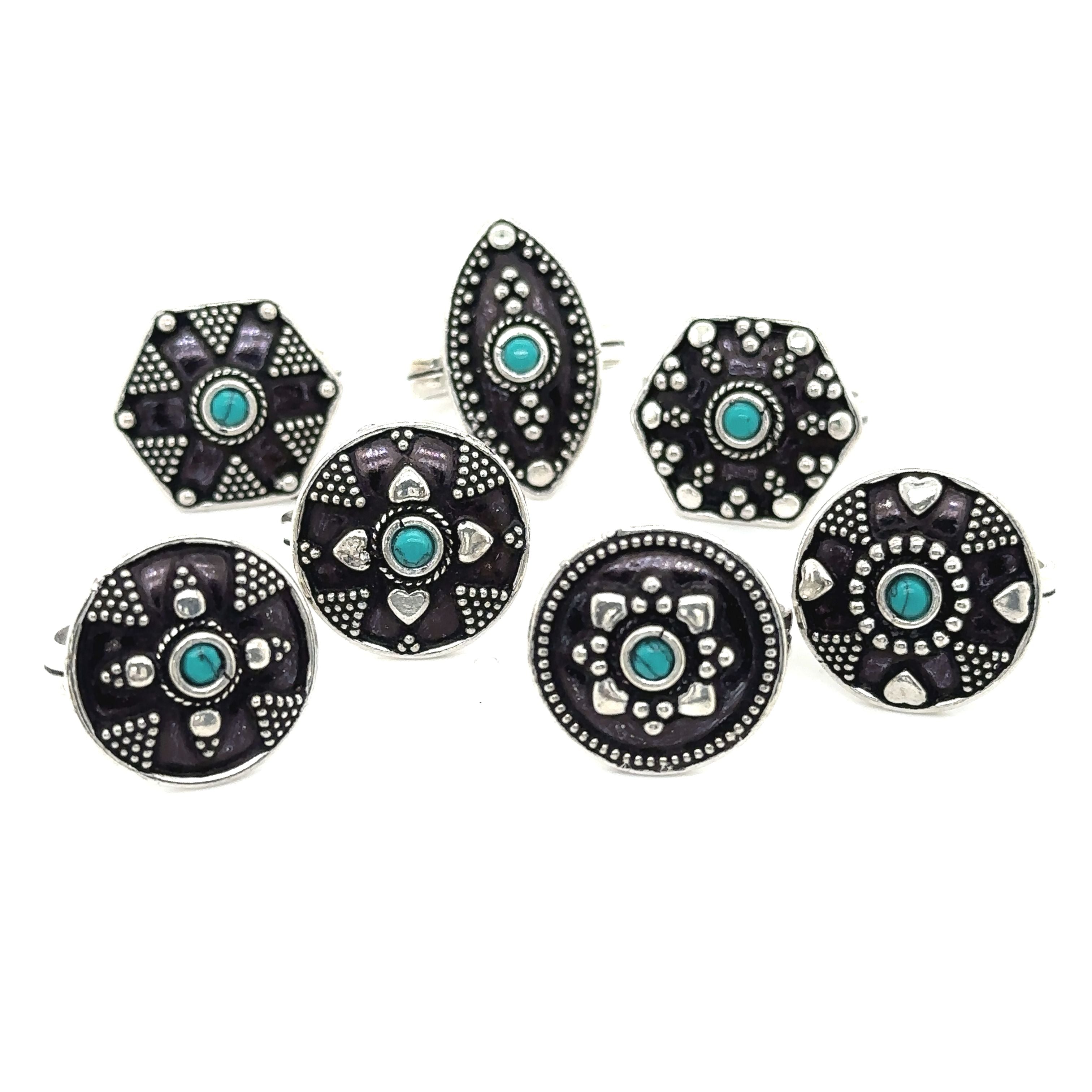 A bohemian masterpiece of stunning Tibetan-style rings featuring turquoise and black stones, known as the Tibetan-Style Rings with Small Stones.