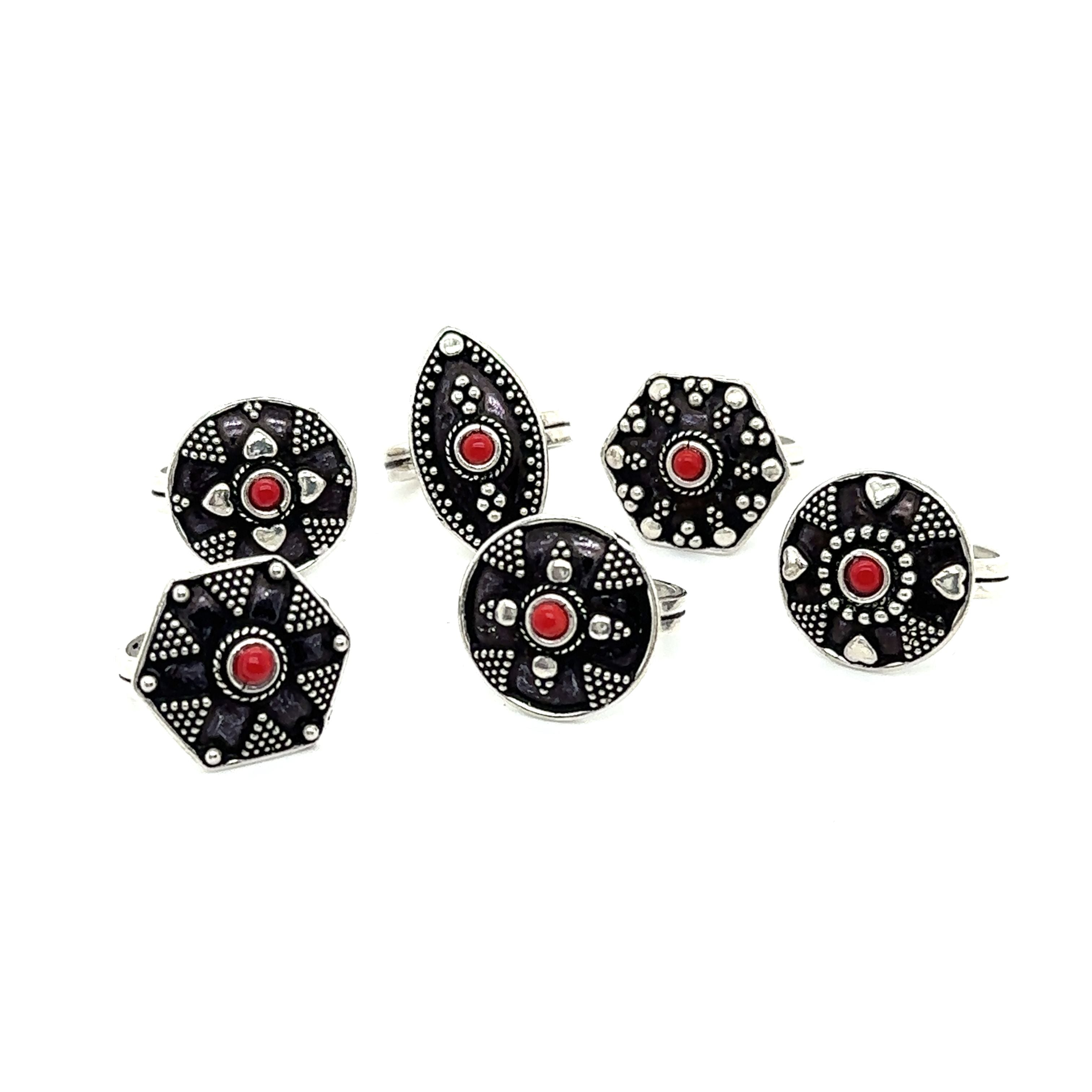 A stunning Tibetan-Style ring adorned with red and black stones, creating a bohemian masterpiece called the Tibetan-Style Rings with Small Stones.