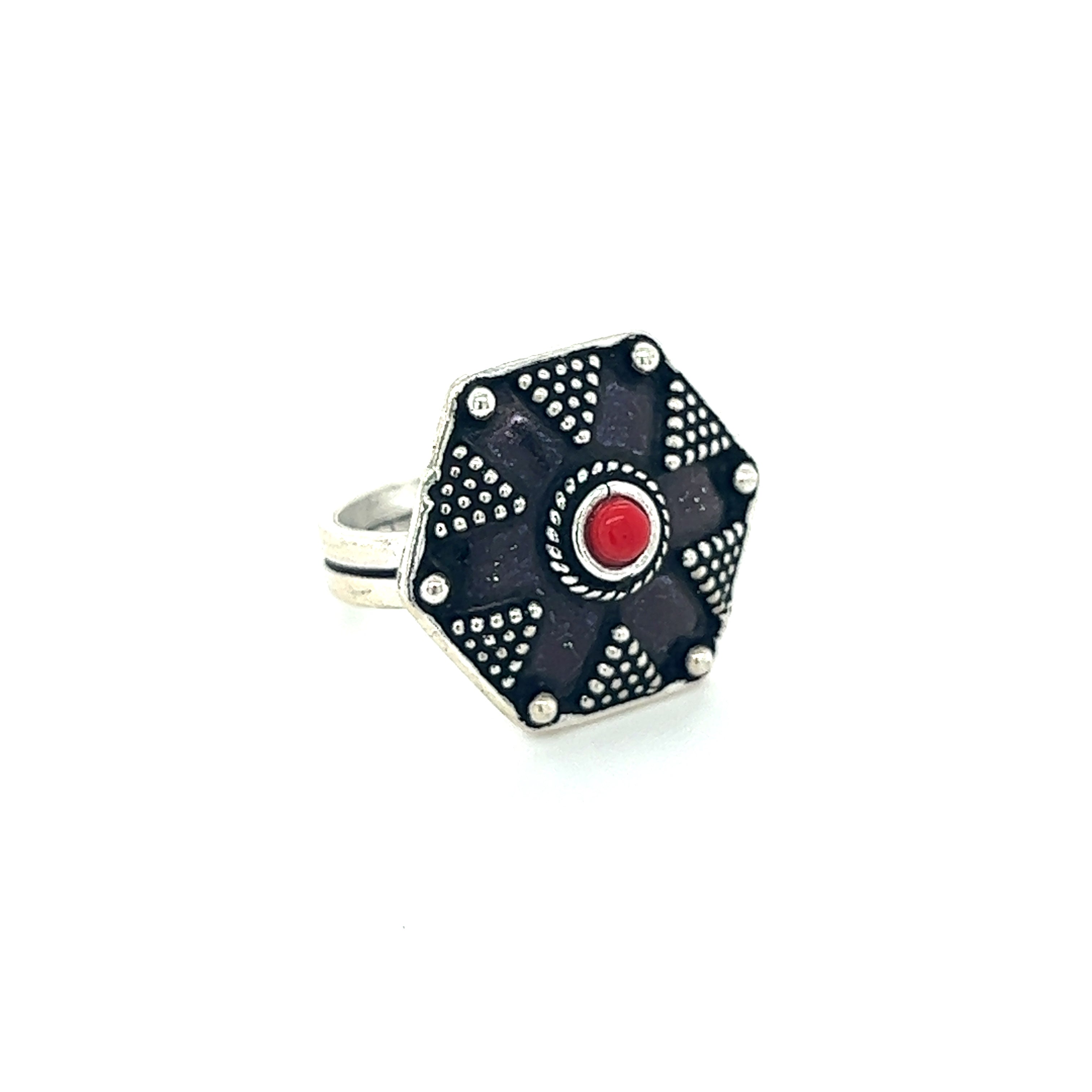 A Stunning Tibetan-Style Ring with Small Stones featuring an octagonal shape and a red stone.