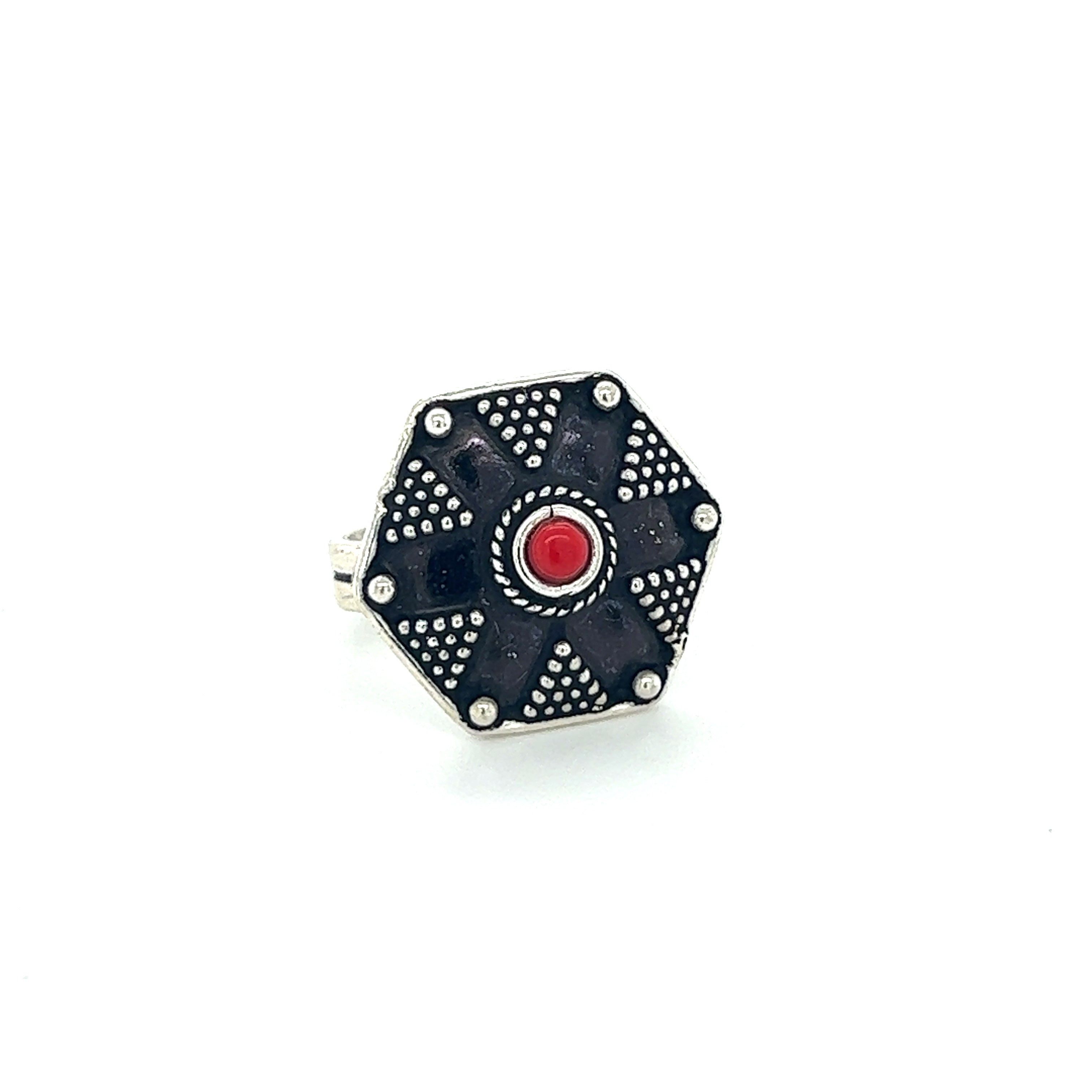 A stunning Tibetan-Style Ring with Small Stones featuring a black and red band adorned with a vibrant red stone.