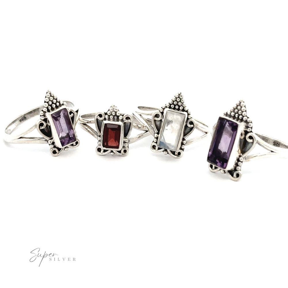 Four ornate silver rings with rectangular gemstone settings in purple, red, white, and purple hues are displayed in a row on a white background. One ring features an Amethyst stone, exuding a Bohemian Princess Ring vibe. The brand name "Super Silver" is in the bottom left corner.