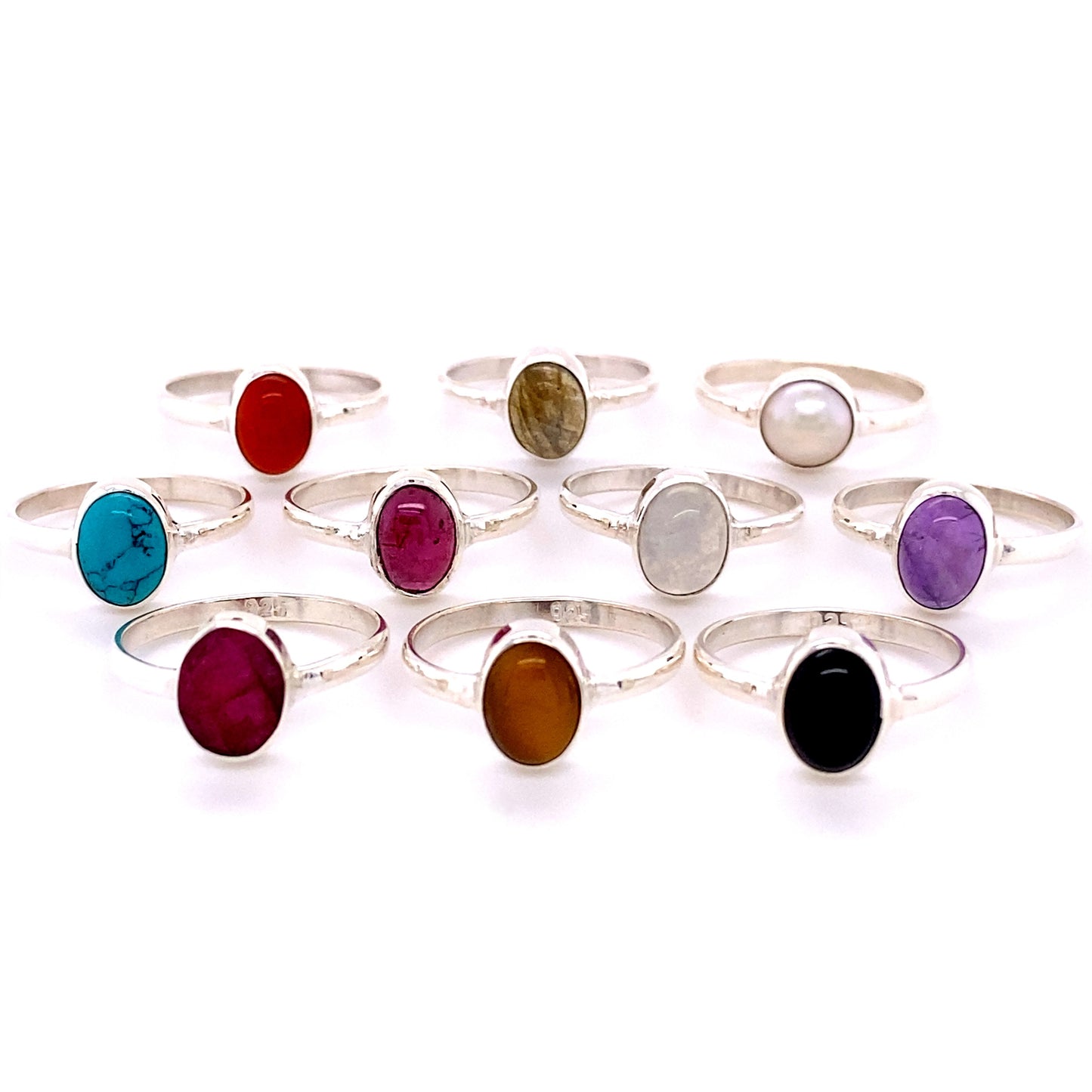 A collection of Simple Oval Natural Gemstone Rings with various colored oval gemstones displayed on a white background.