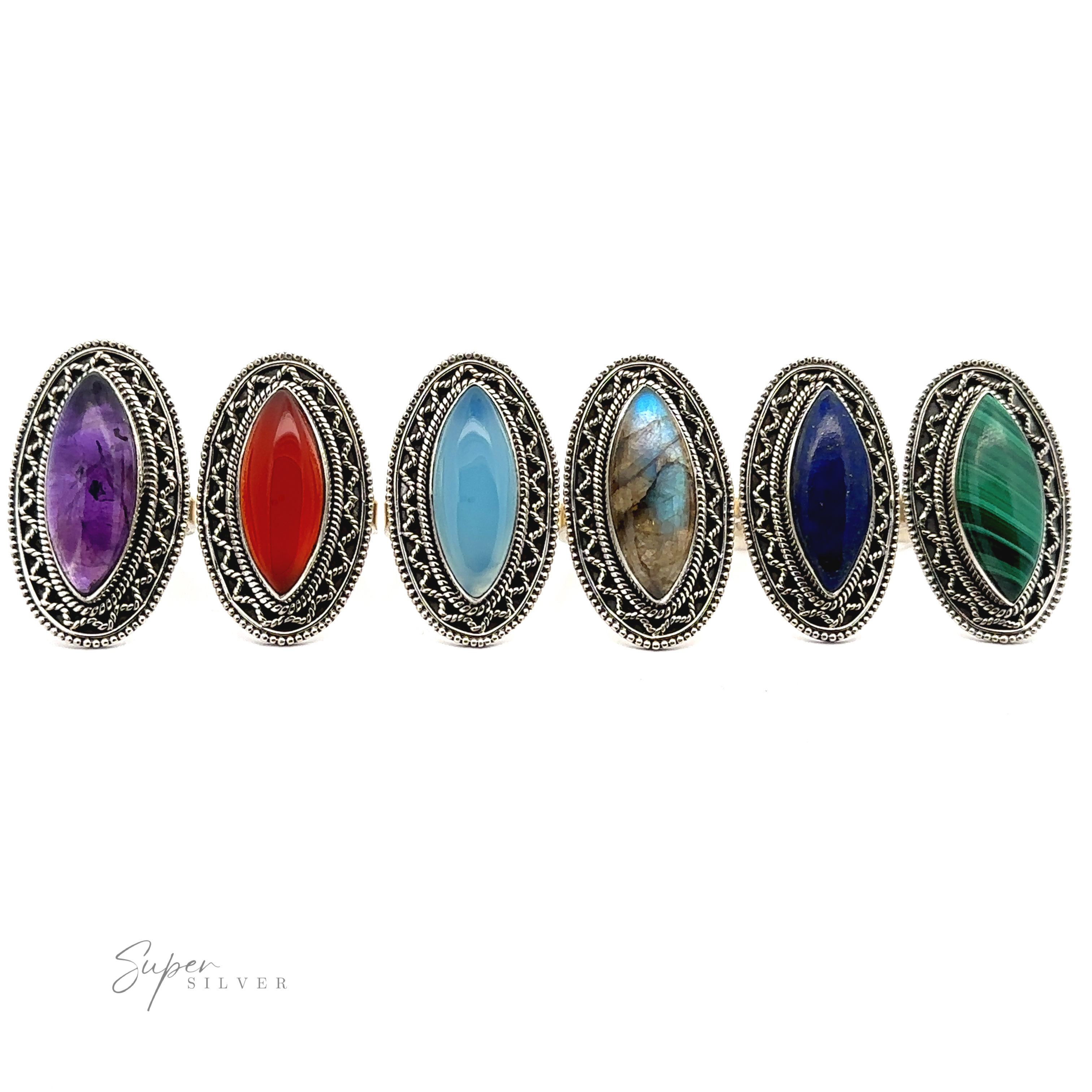 Six Marquise Shaped Gemstone Rings With Vintage Shield Borders with various colored stones in the center, including purple, red, light blue, brown, dark blue, and green, displayed in a row on a plain white background. Each ring boasts a Bohemian twist that adds an eclectic charm to any look.