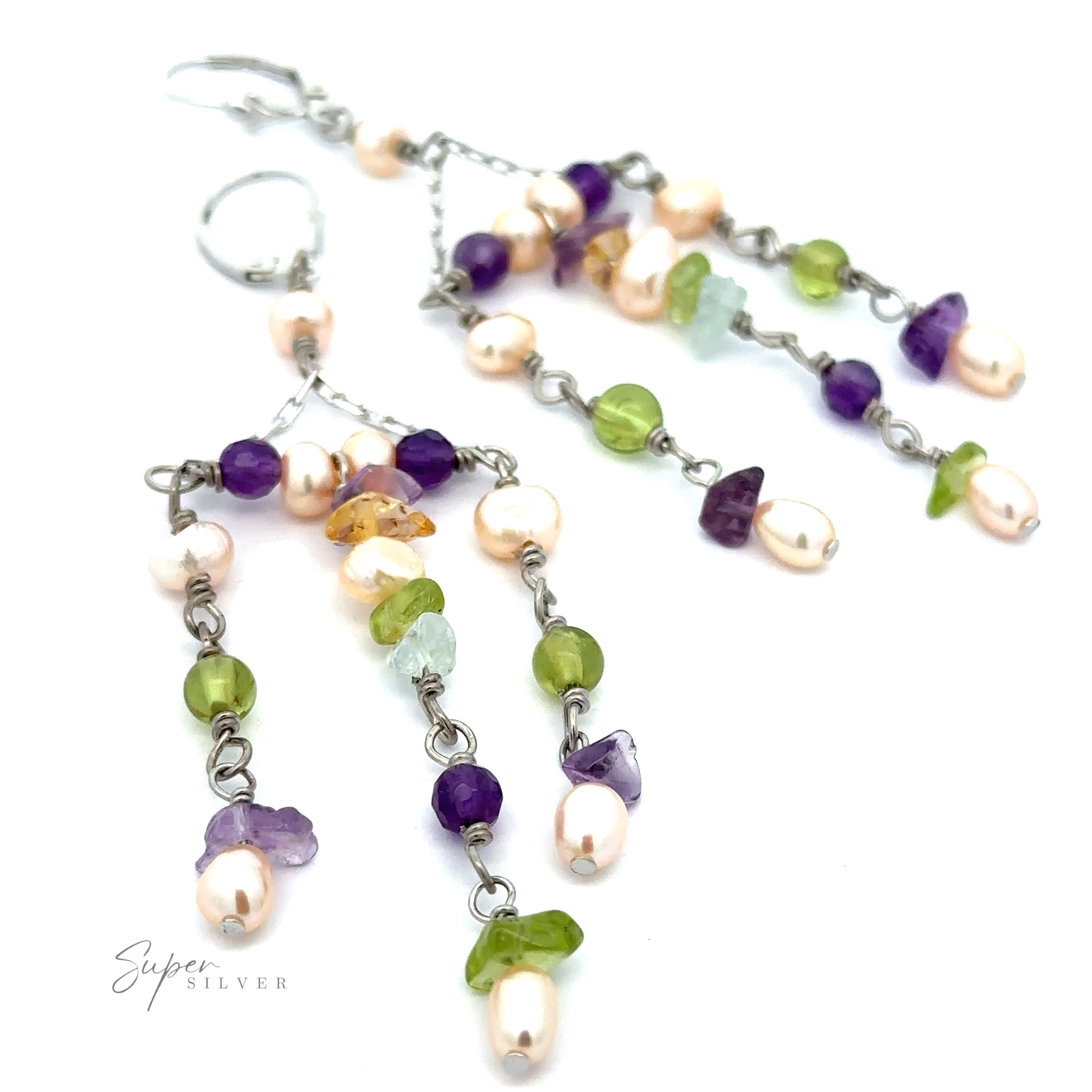 These Dangly Multicolor Bead Earrings feature sterling silver chains adorned with multicolor beads, including green, purple, and pearly white accents.