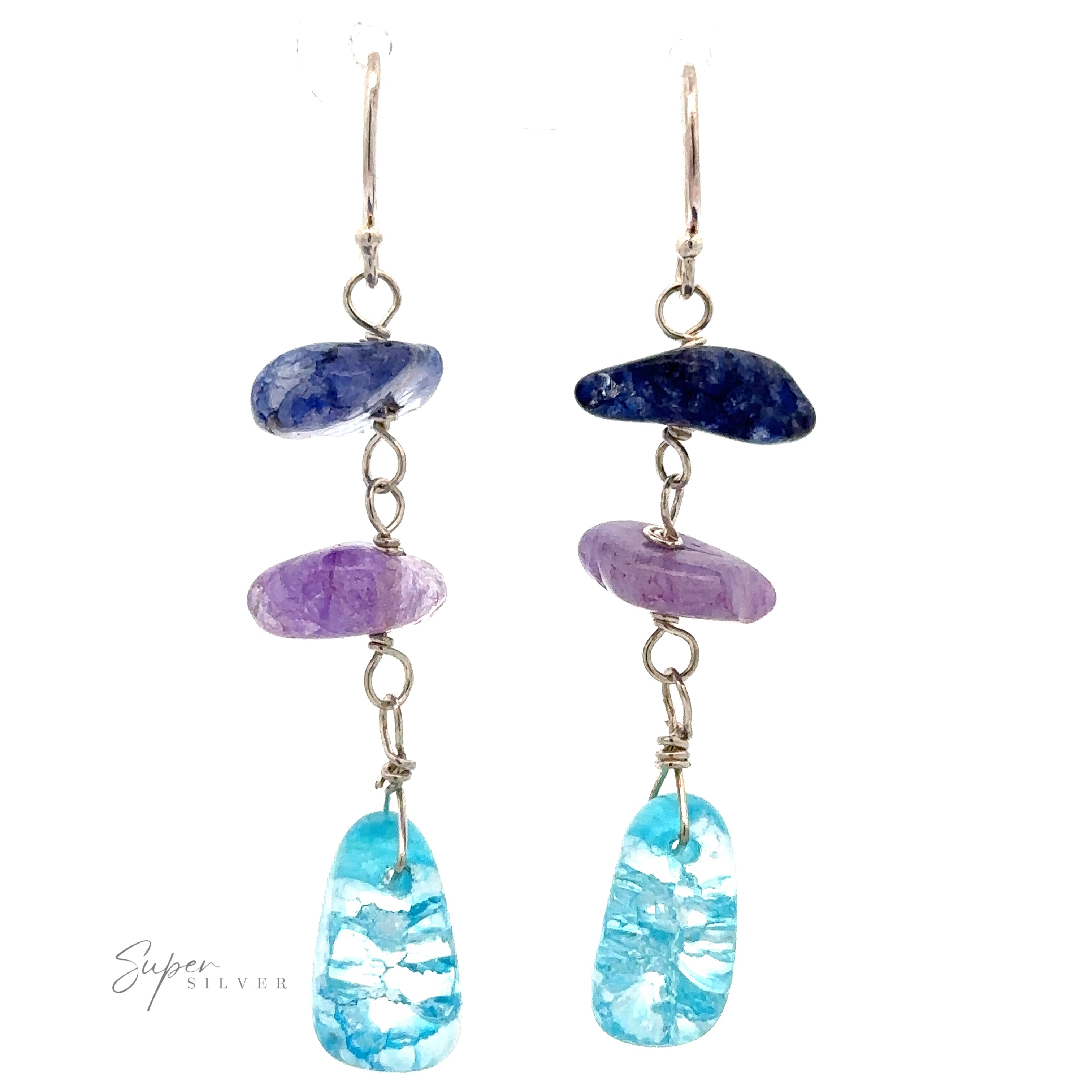 A pair of Beaded Blue and Purple Earrings with three stones each. The bright blue beads, purple beads, and turquoise stones are connected by Sterling Silver chains. The bottom stones are irregularly shaped turquoise. Silver hooks at the top.