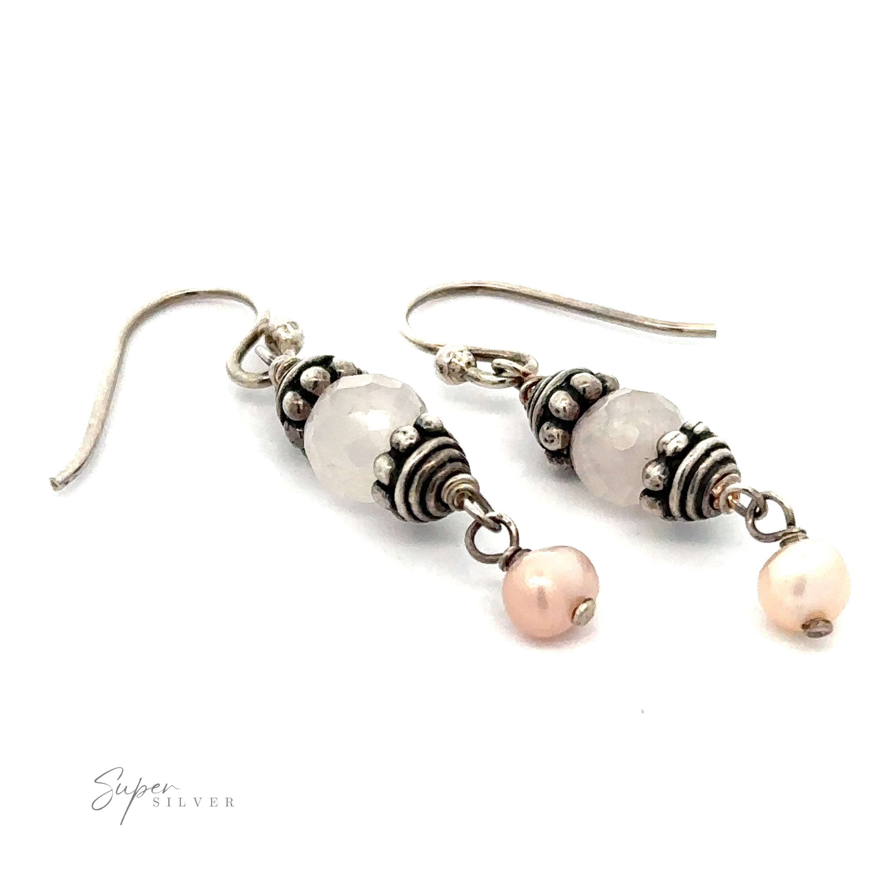 A pair of Beaded Pink and Pearl Earrings with intricate detailing. The earrings feature a large spherical bead, small faceted decorative elements, and a small pearl dangling at the bottom.