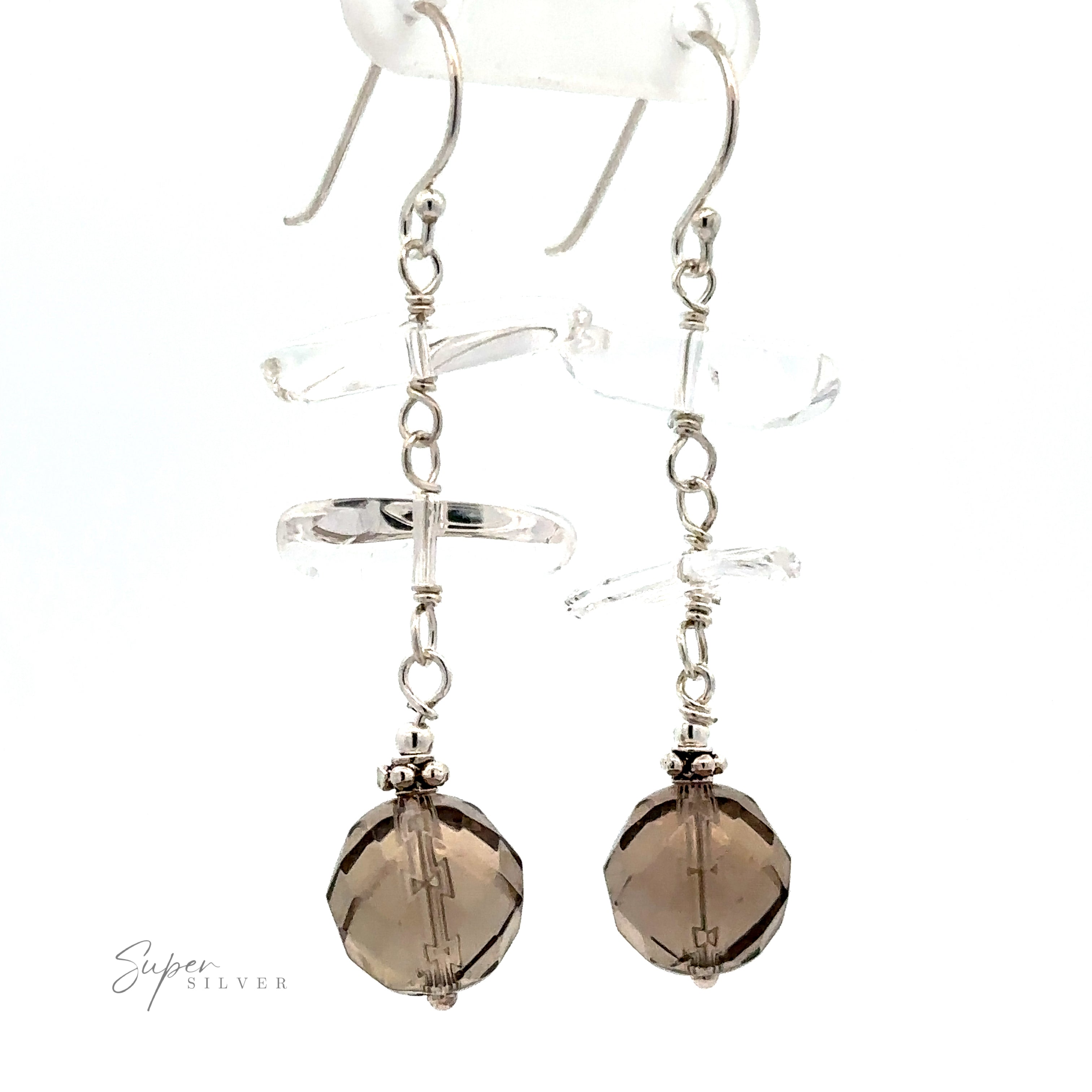 Pair of "Earrings with Clear and Faceted Gray Beads" featuring clear crystal-cut geometric crystals and faceted multicolored beads hanging from the end. "Super Silver" logo is visible in the lower left corner.