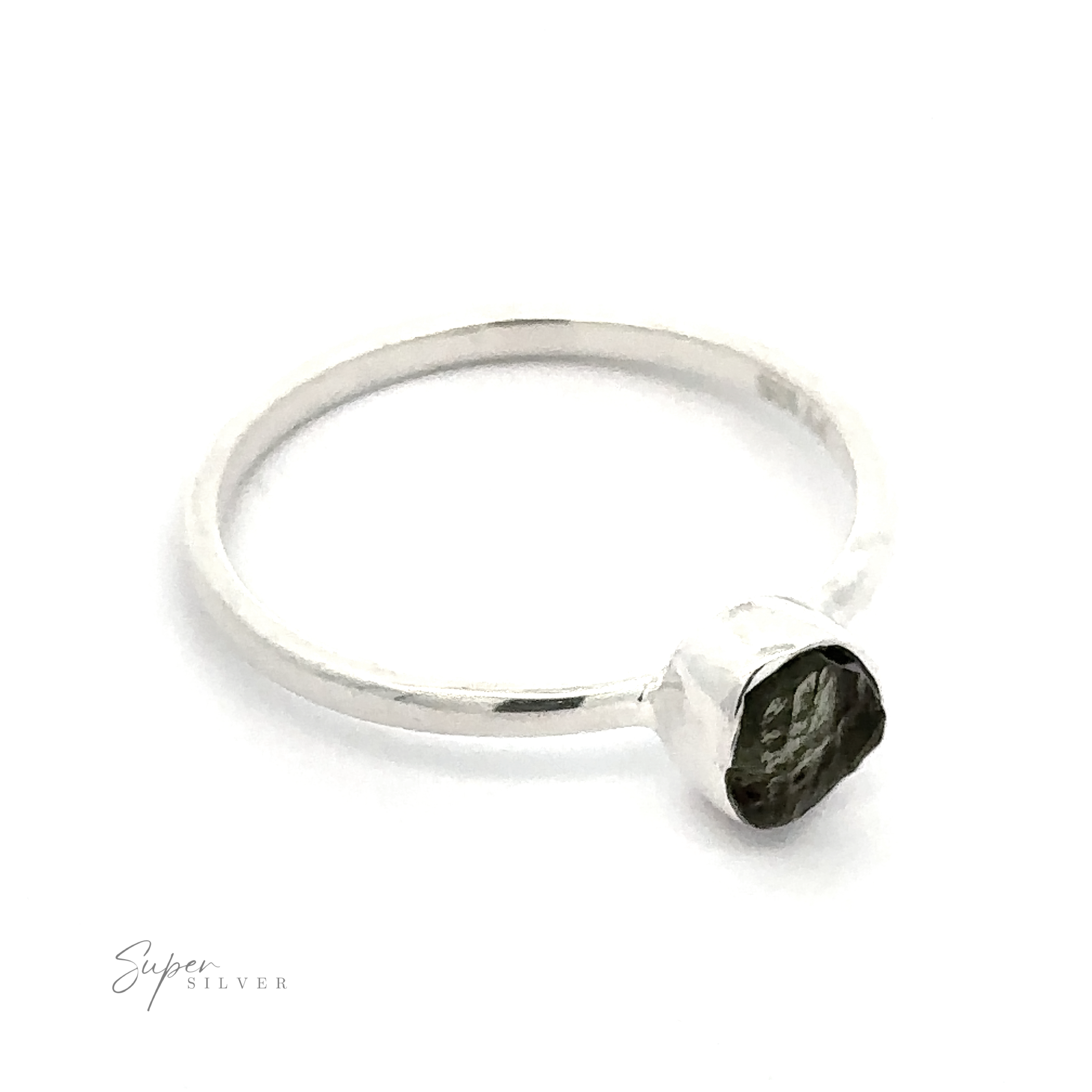 Raw Moldavite ring with a single hexagonal, dark gemstone on a white background.
