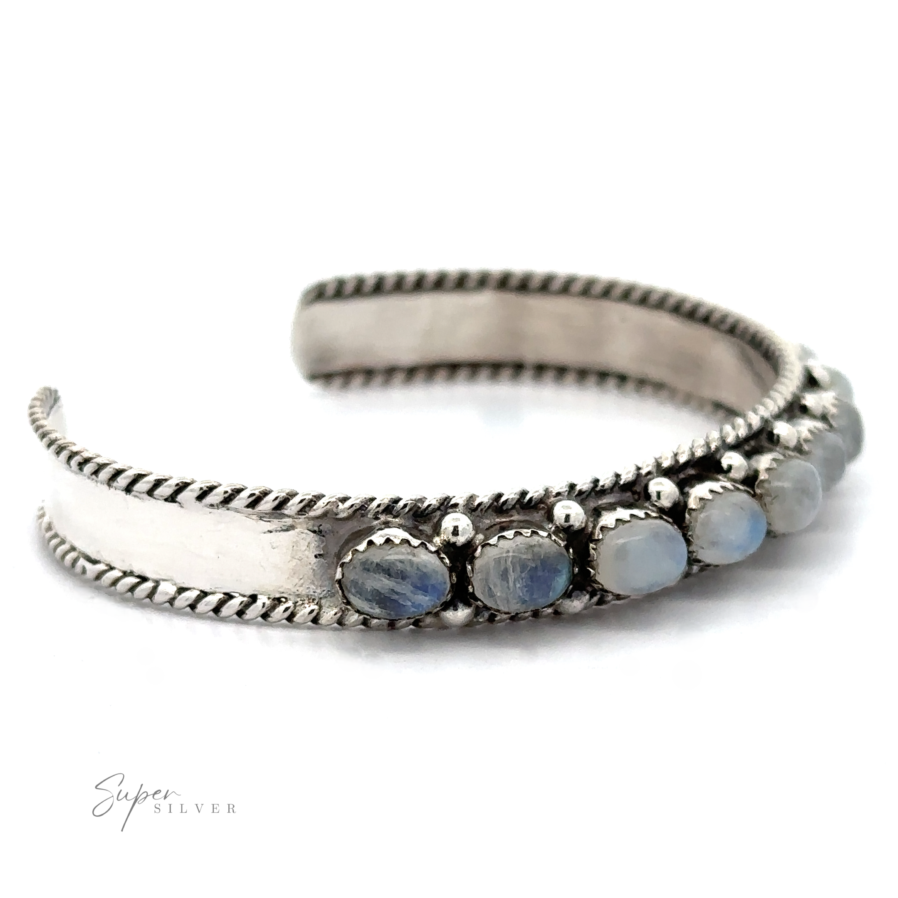 A stunning Oval Moonstone Cuff Bracelet featuring a rope-like edge design and seven oval moonstone beads set in a row, known for their metaphysical properties and emotional healing benefits.