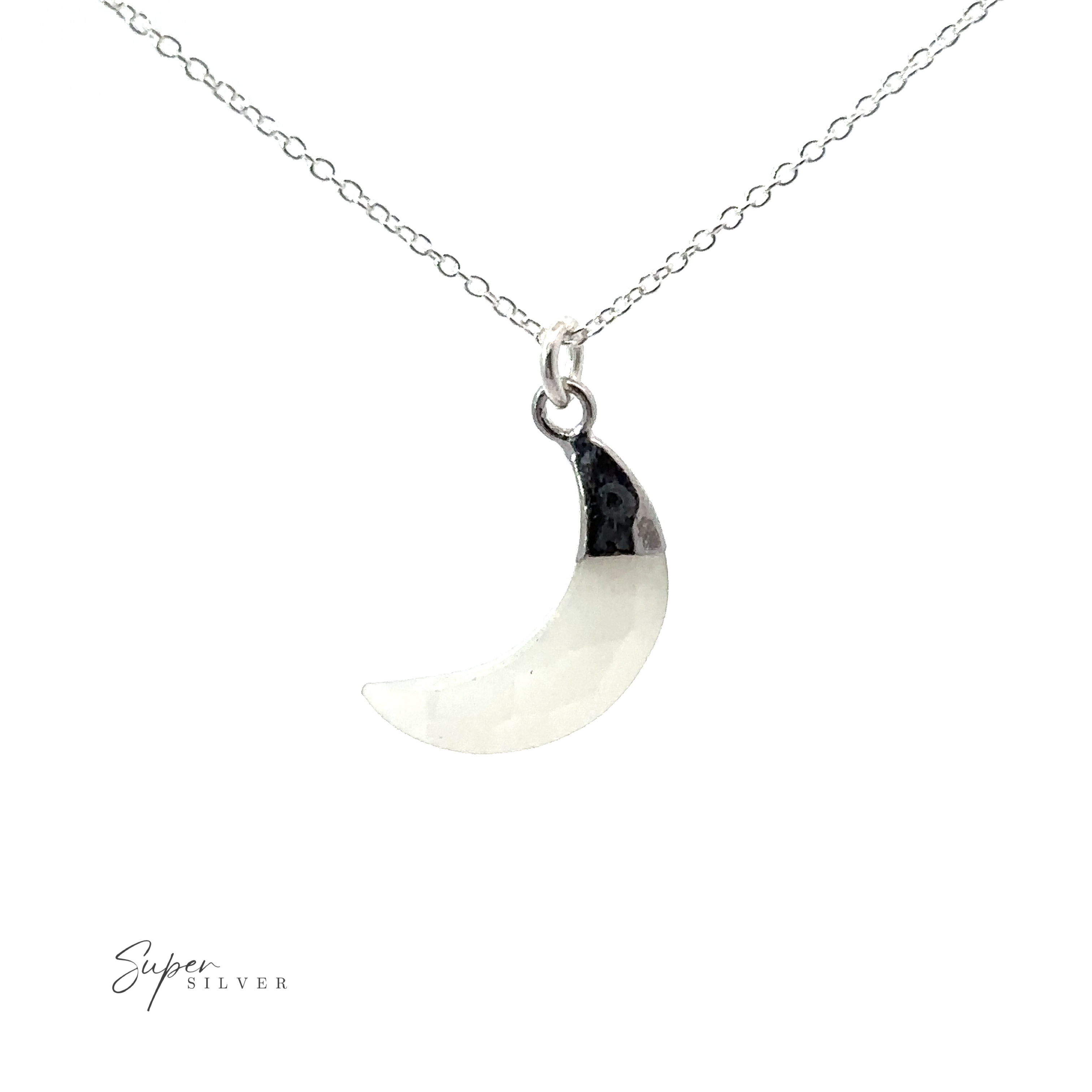 A Delicate Stone Moon Necklace featuring a white crescent moon on a silver chain.