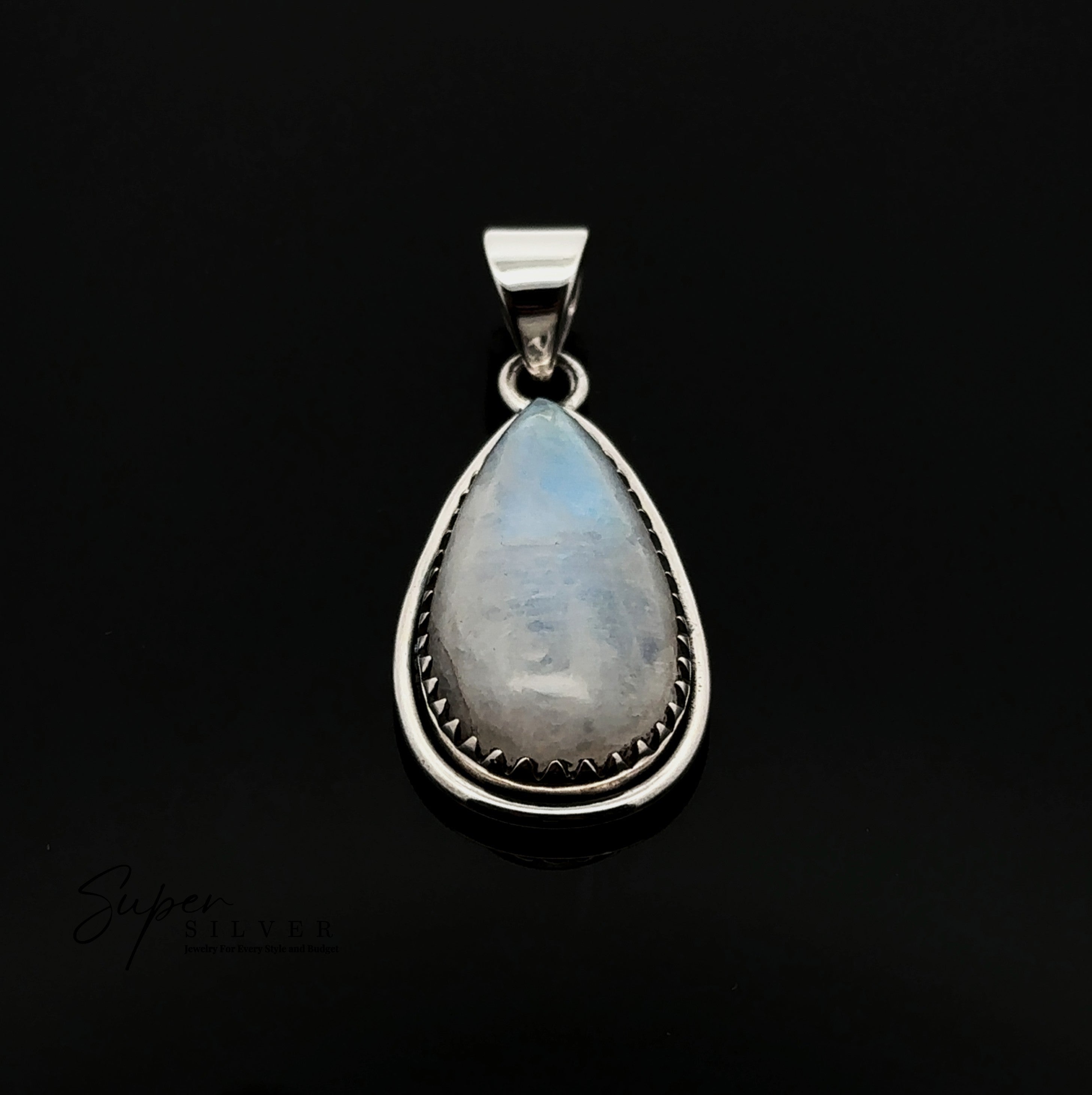 The Teardrop Moonstone Pendant features a moonstone in a sterling silver bezel with a textured edge and boho detailing, shown against a black background.