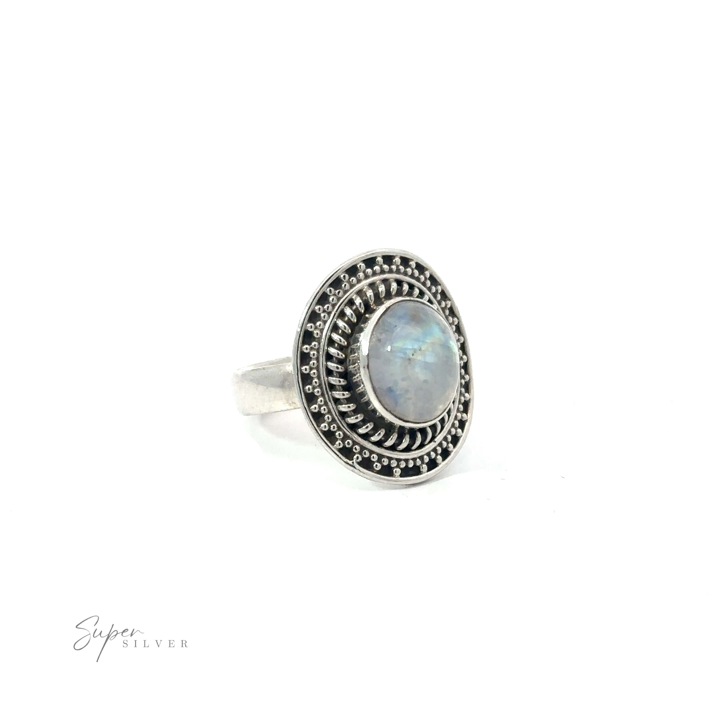An oval Moonstone Ring With Braided Disc Design on a white background.