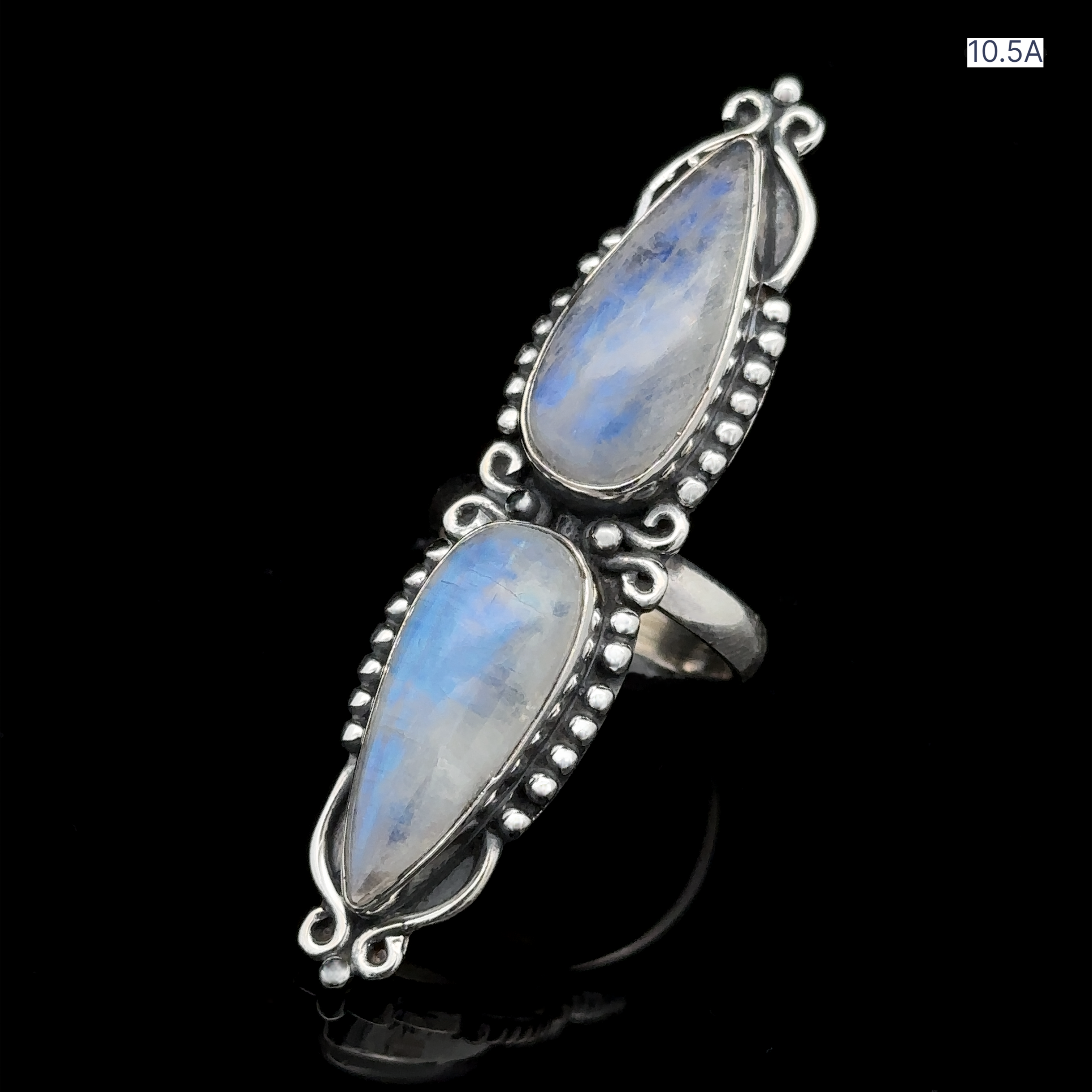 The Long Double Teardrop Moonstone Ring, featuring two sizable, pear-shaped moonstones set vertically on an intricate sterling silver band, captures attention effortlessly.