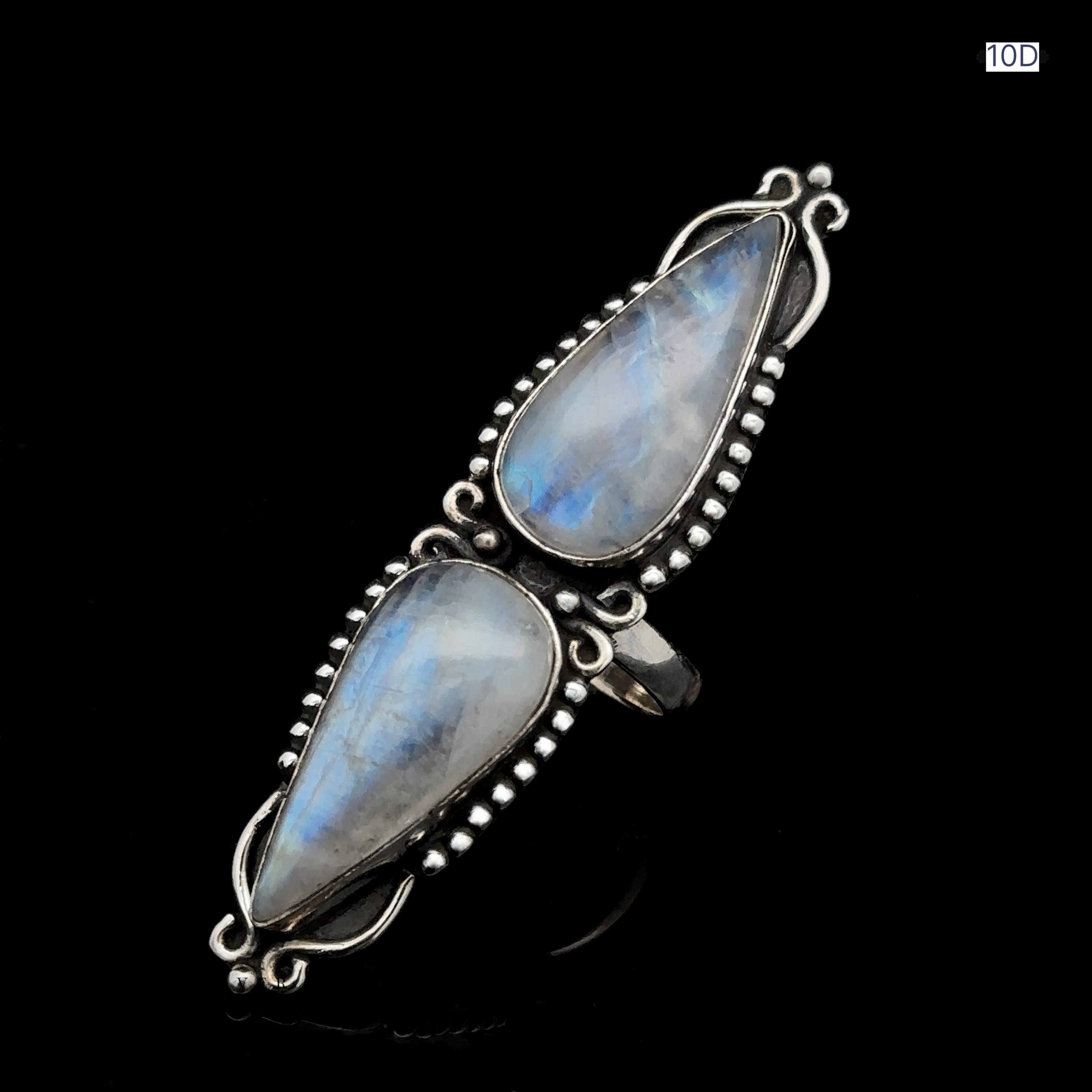 Long Double Teardrop Moonstone Ring, crafted from sterling silver and adorned with two teardrop-shaped moonstones in an ornate design, displayed on a black background.