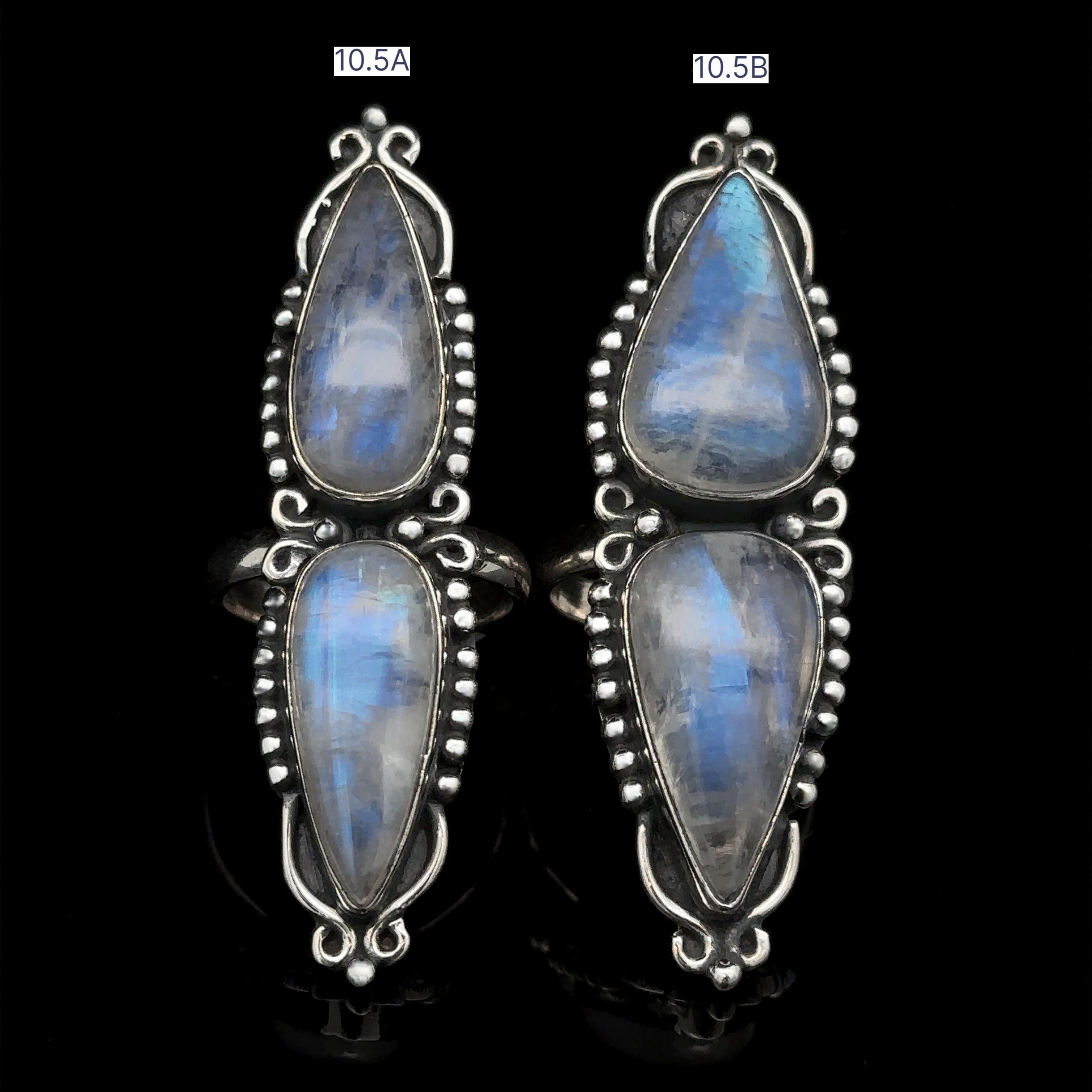 Two Long Double Teardrop Moonstone Rings, each adorned with two teardrop-shaped moonstones, labeled as 10.5A and 10.5B against a black background.