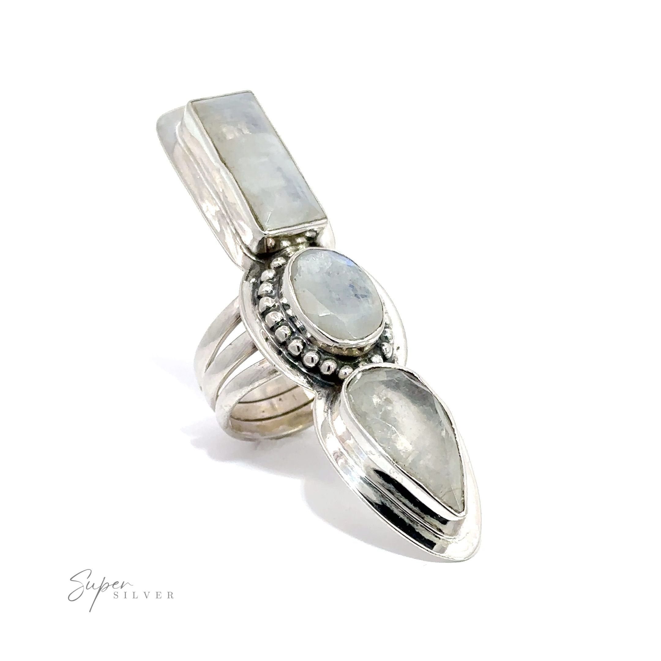 A Statement Faceted Moonstone ring with three stones on it.