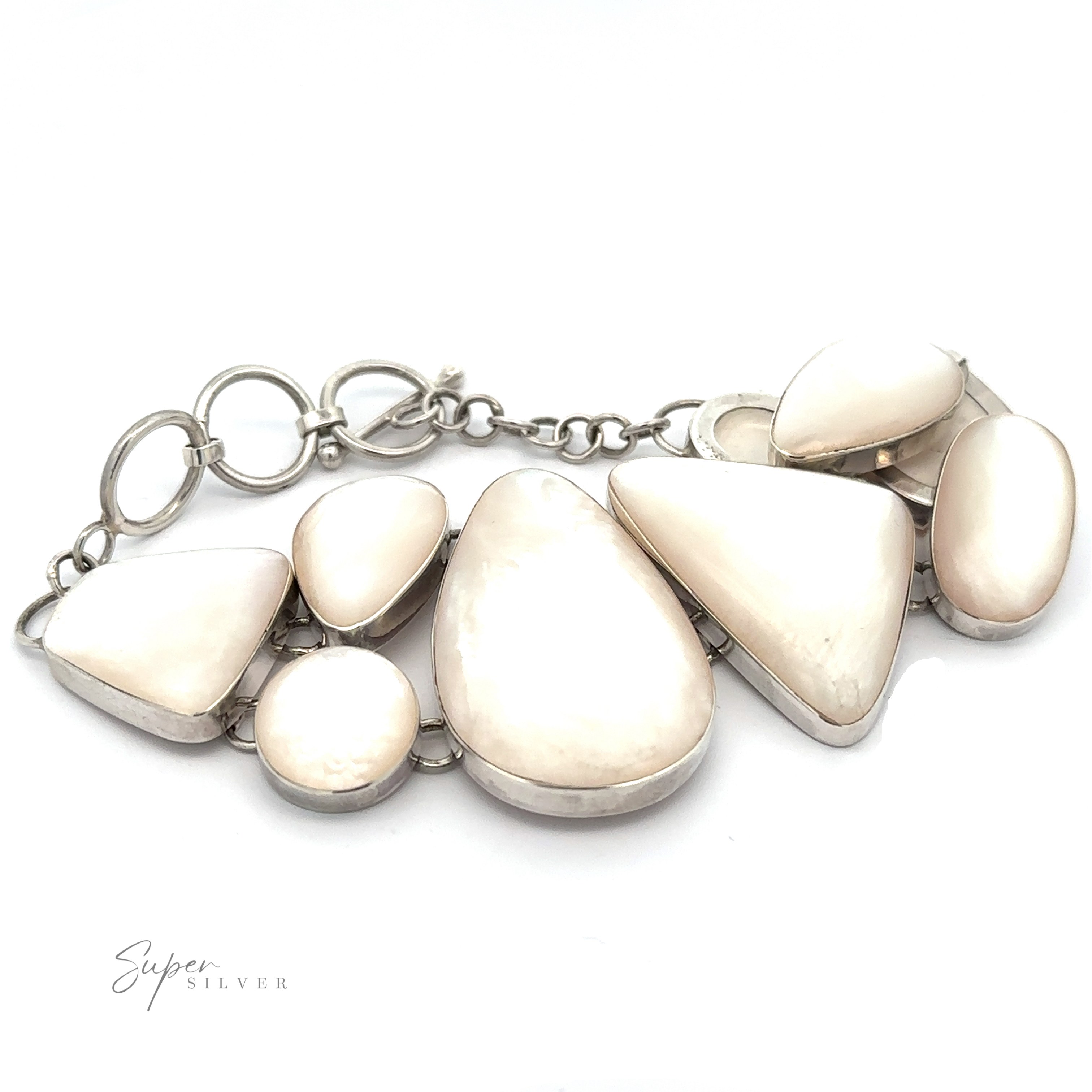 A Statement Mother of Pearl Bracelet in sterling silver features multiple large, polished mother-of-pearl stones in various geometric shapes, connected by a chain with circular links. The bracelet is displayed against a plain white background.
