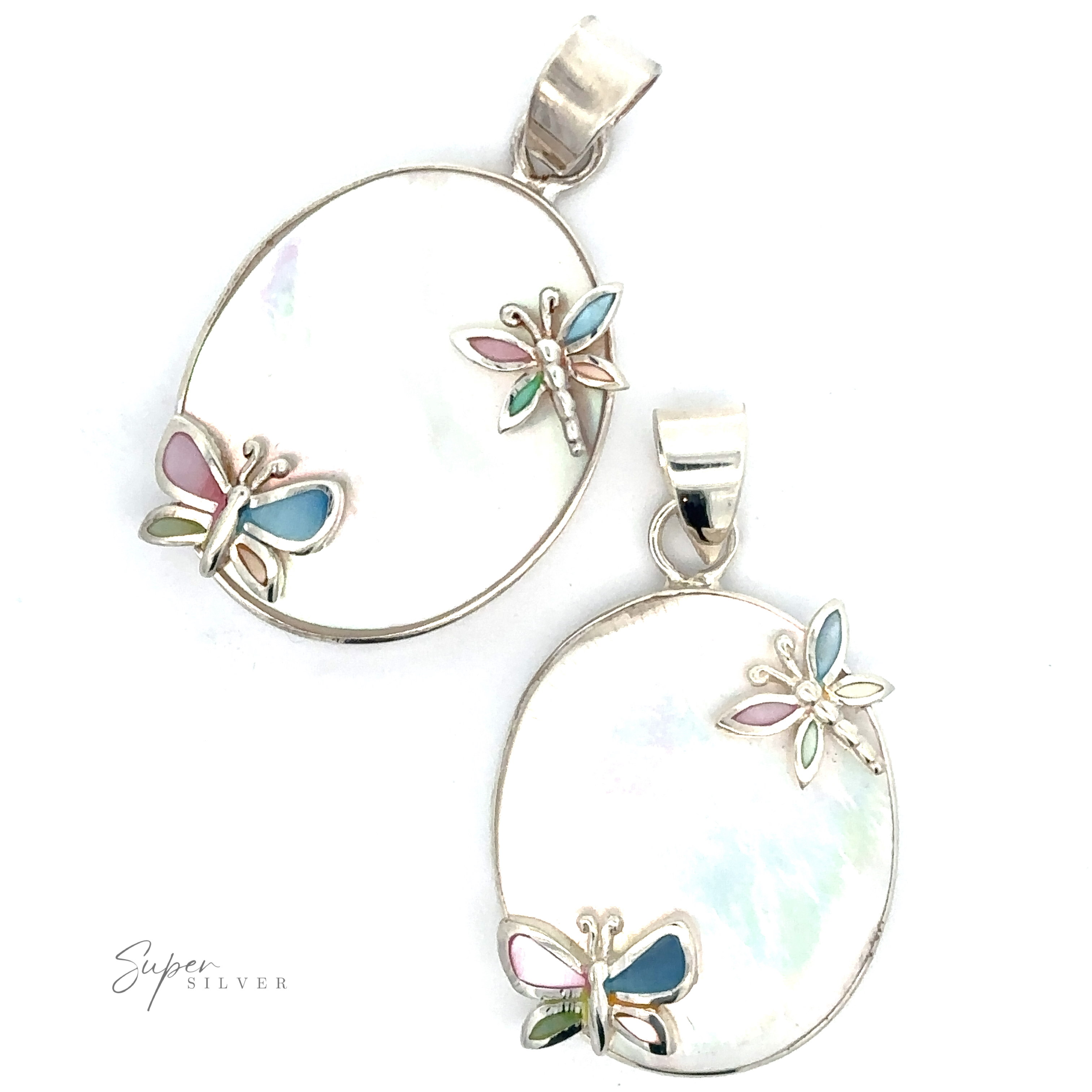 Two oval-shaped pendants featuring butterfly and dragonfly decorations with pink, blue, and green accents on a white background, labeled "Mother of Pearl Pendant with Butterflies and Dragonflies." These exquisite pieces are enhanced by a touch of mother-of-pearl pendant detail.