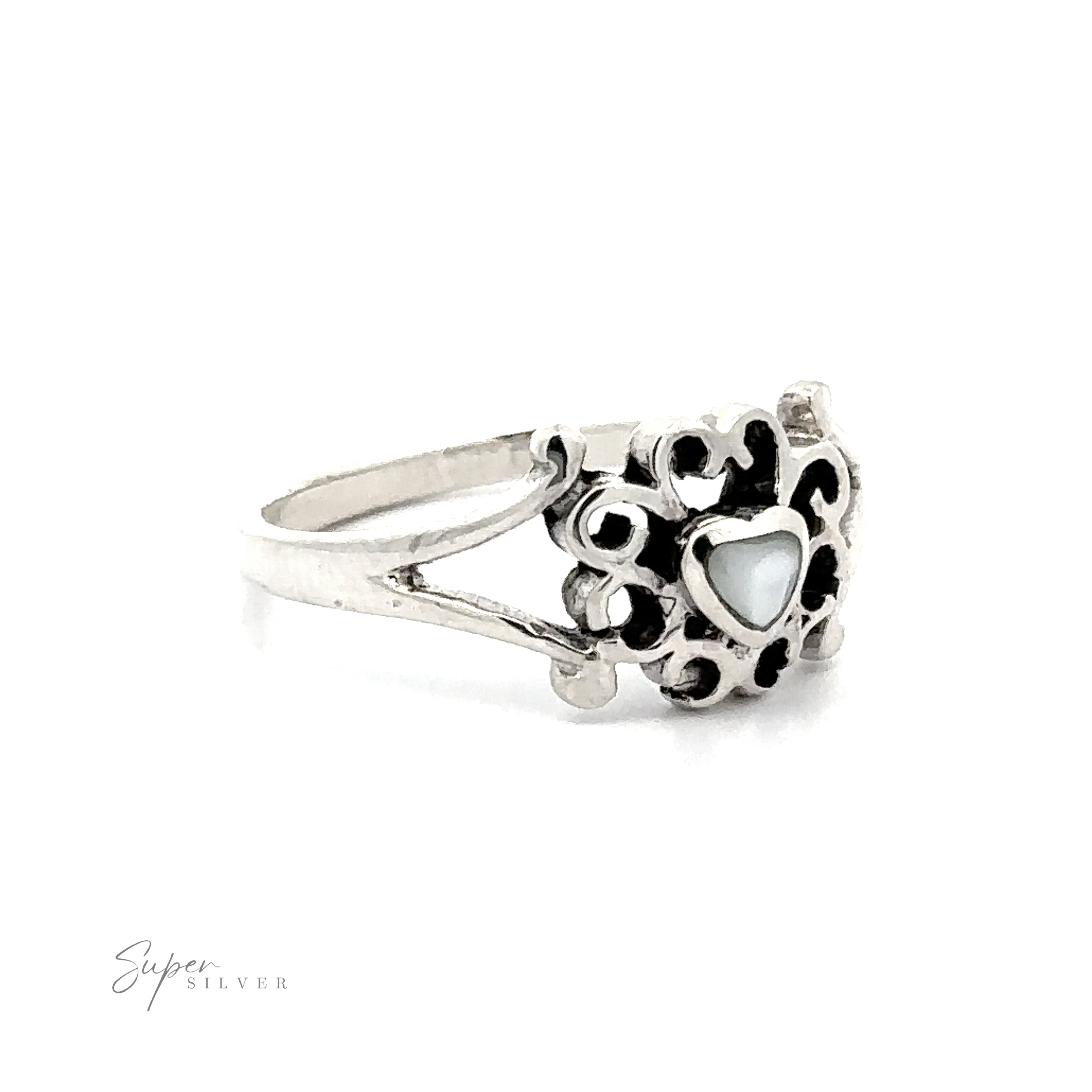 A Filigree Design Surround Inlaid Stone Heart ring with a heart shaped mother of pearl stone.