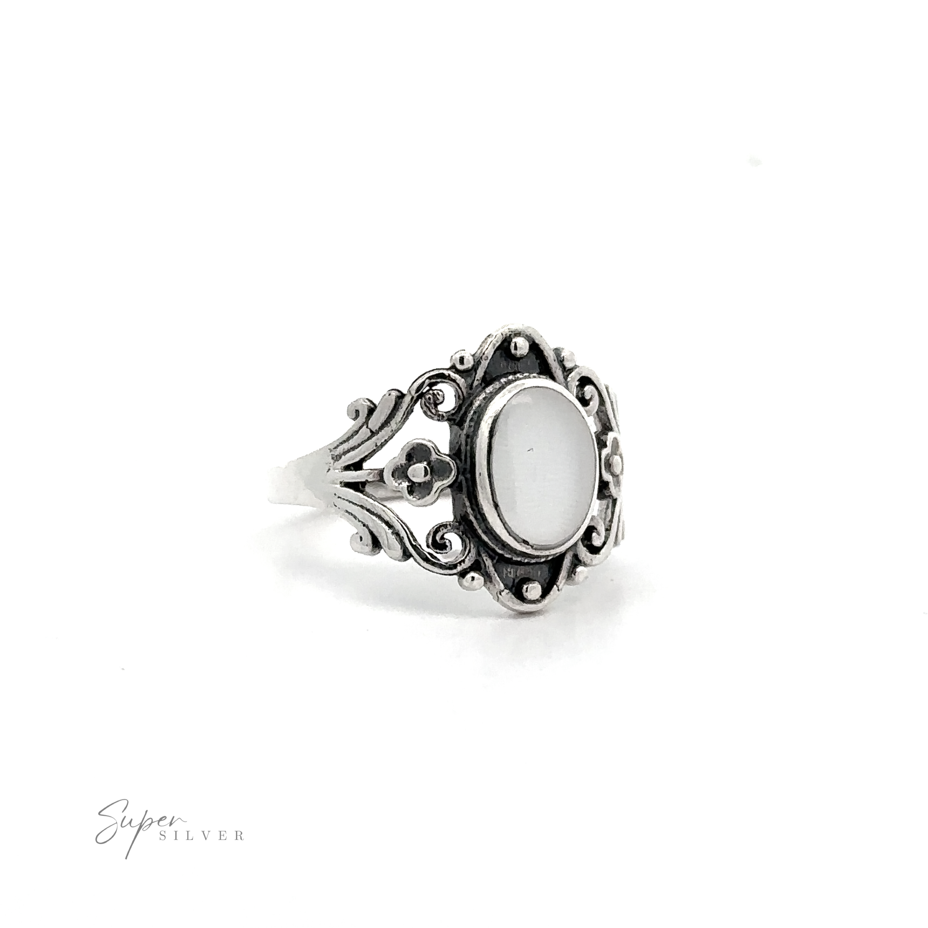 Floral Filigree Inlay Stone Ring with a white stone.