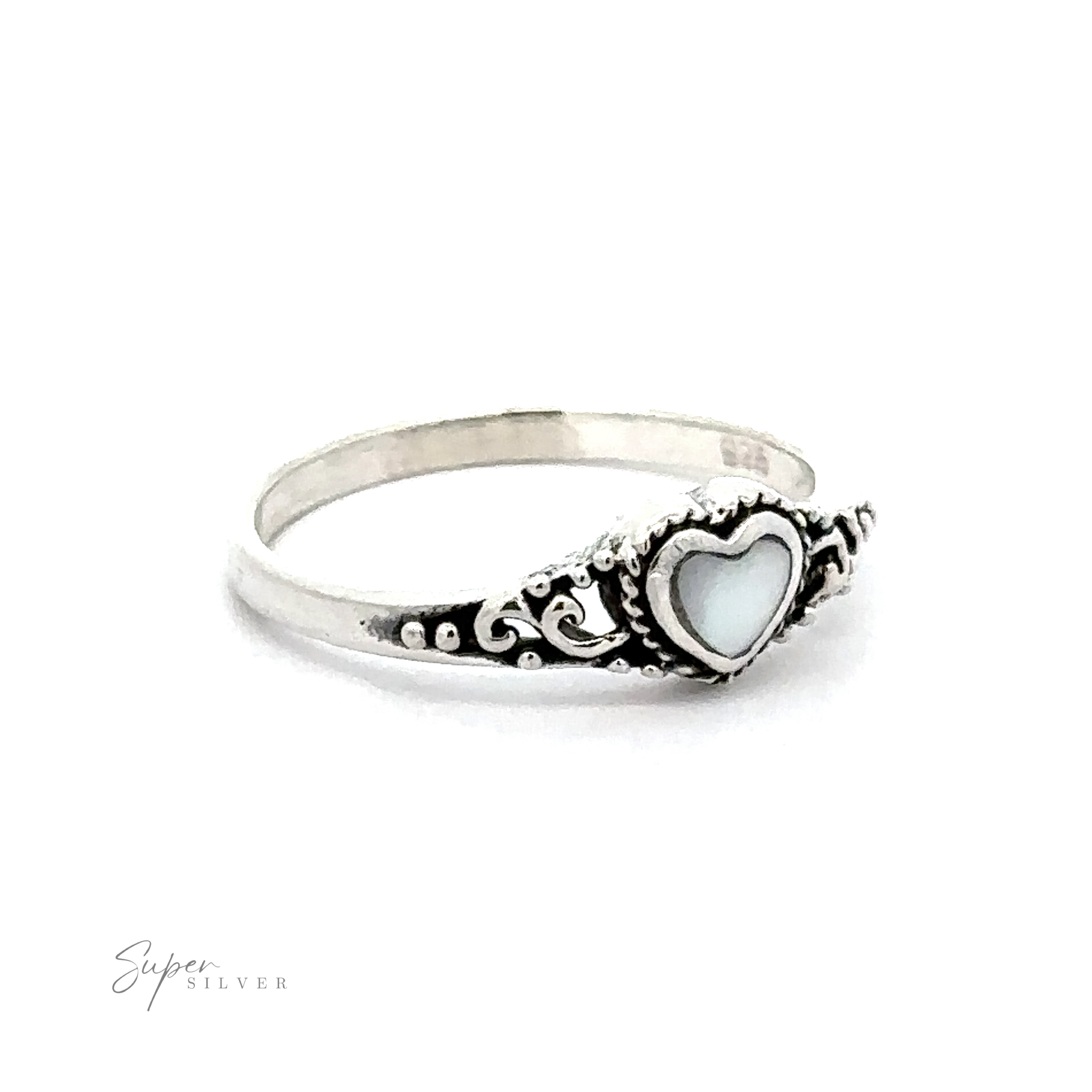 A Dainty Heart Filigree Ring with Inlaid Stones with a Bali-style filigree design and white mother-of-pearl.