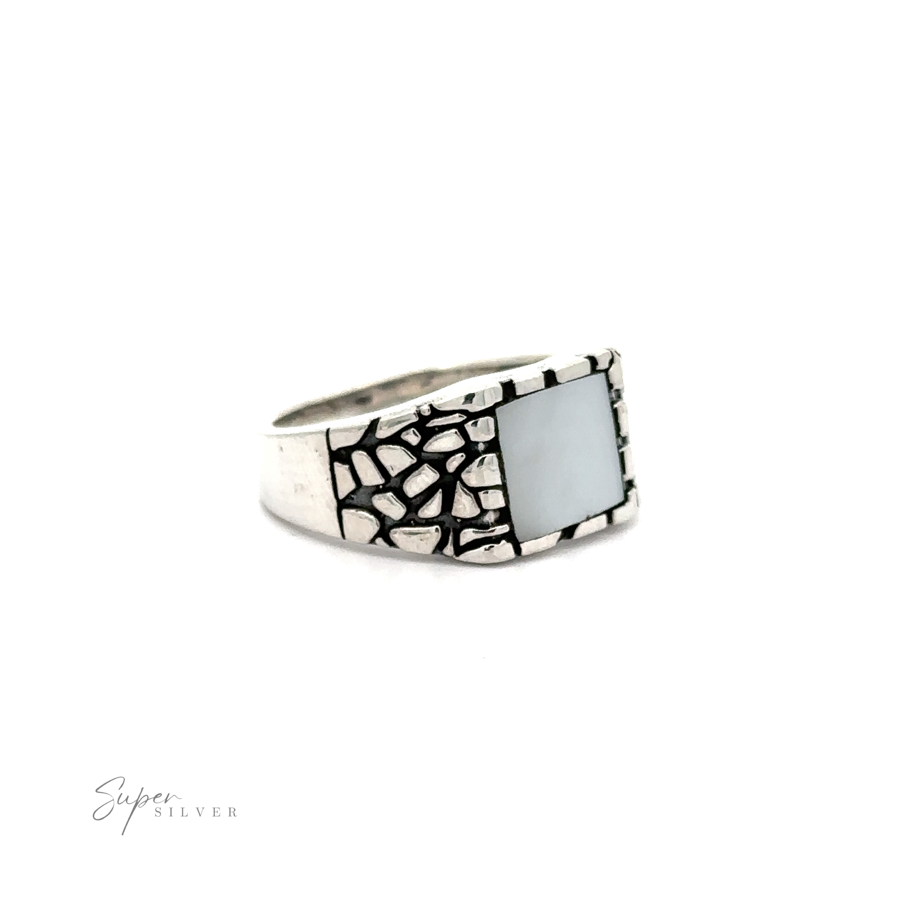 A Stone Signet Ring with A Dragon Scale Pattern with an inlaid white stone.
