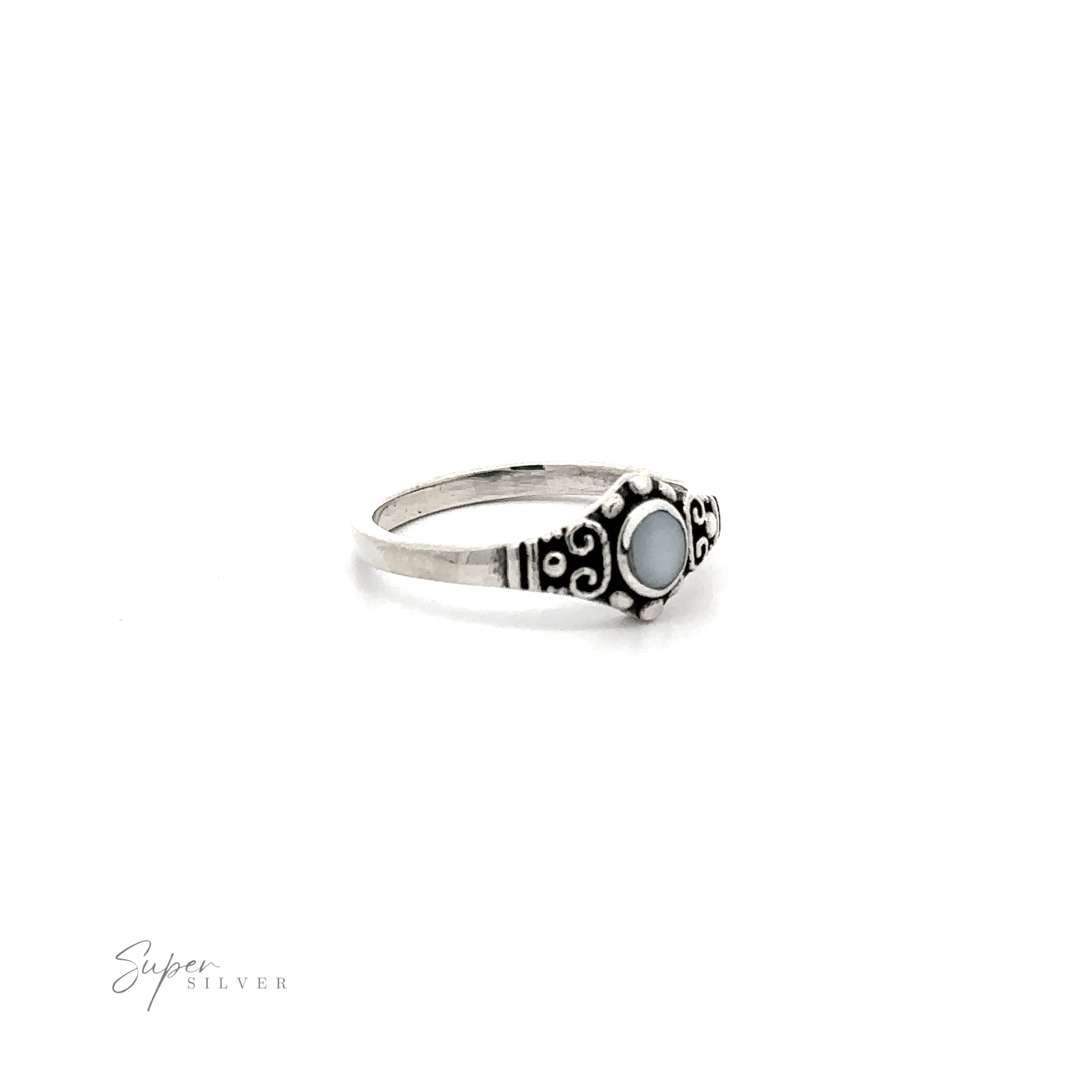 A Dainty Inlaid Stone Ring With Silver Beads and Swirls .925 Sterling Silver ring with an inlaid blue stone.