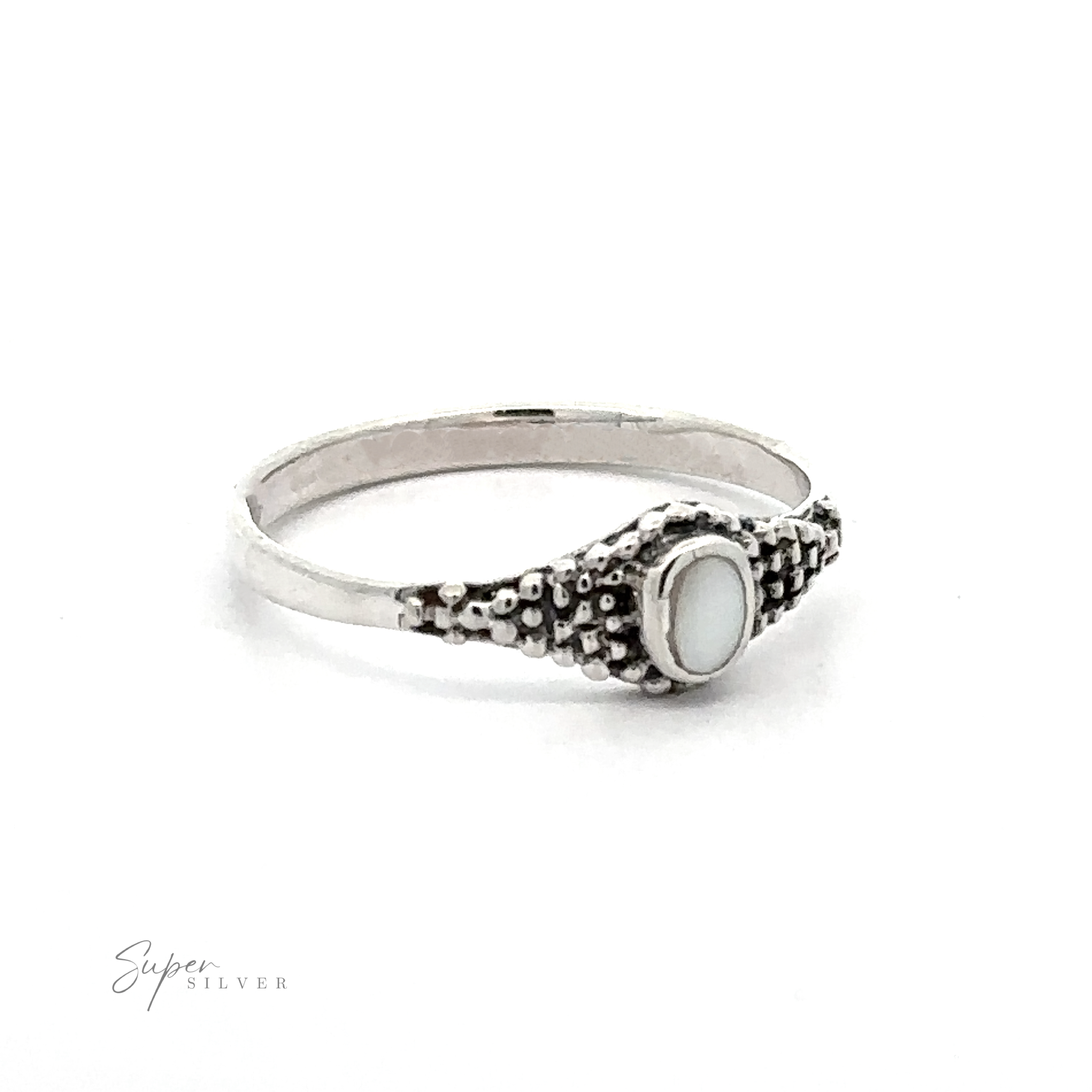 A Dainty Inlaid Ring with Beaded Texture accented by Bali-style beading.