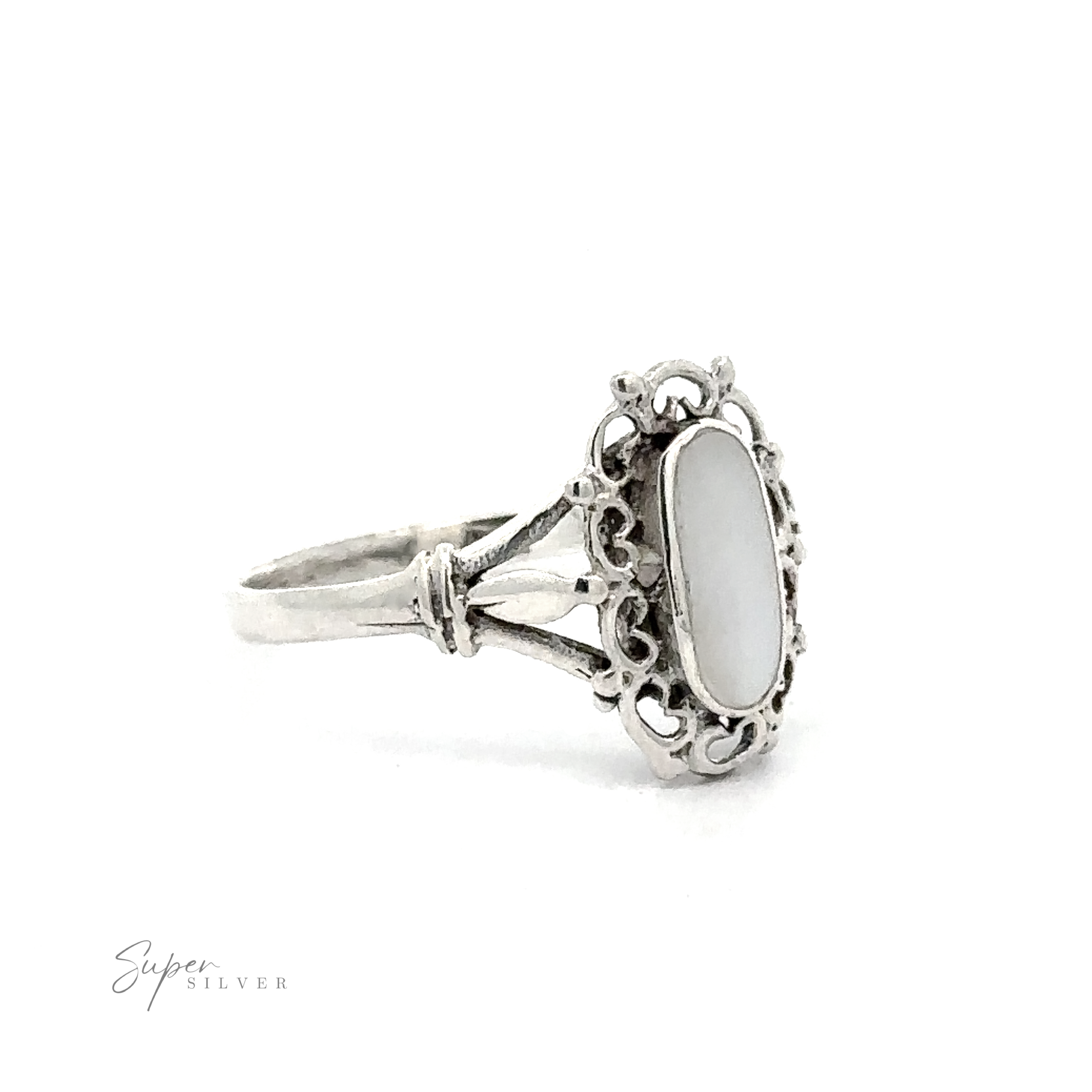 A Inlaid Oval Ring with Filigree Heart Border on a white background.