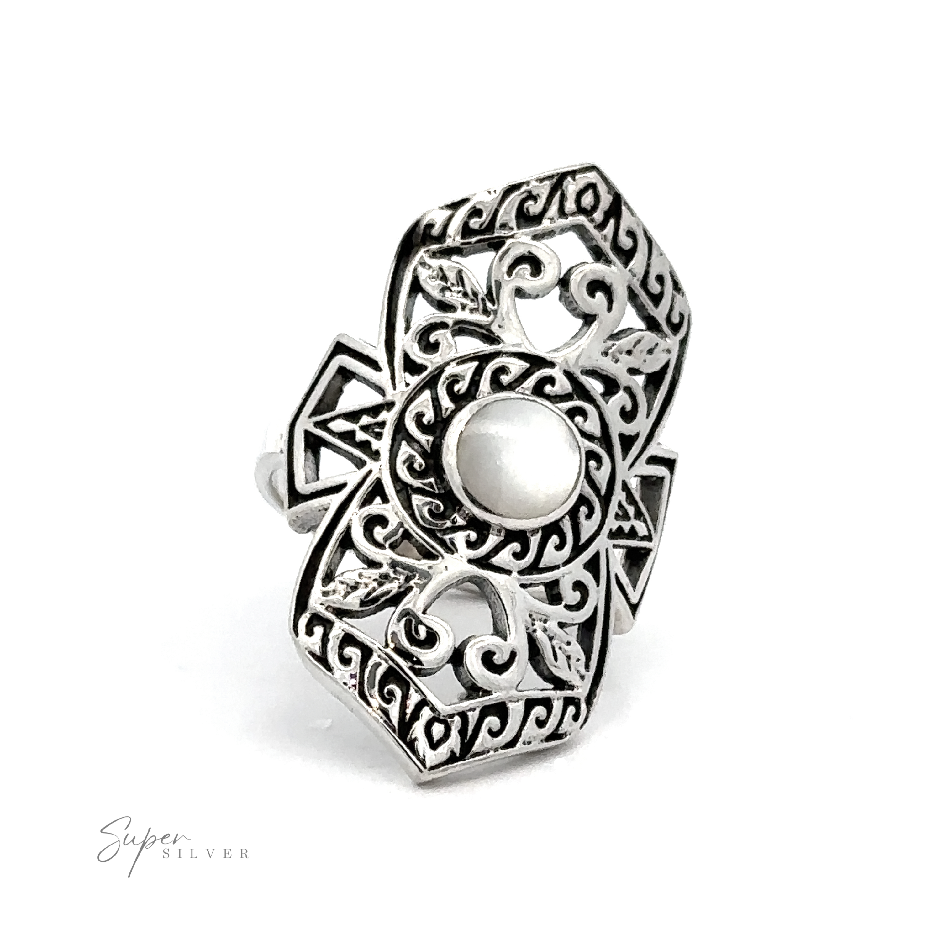 An elaborate filigree shield ring with stone center and intricate scrollwork.