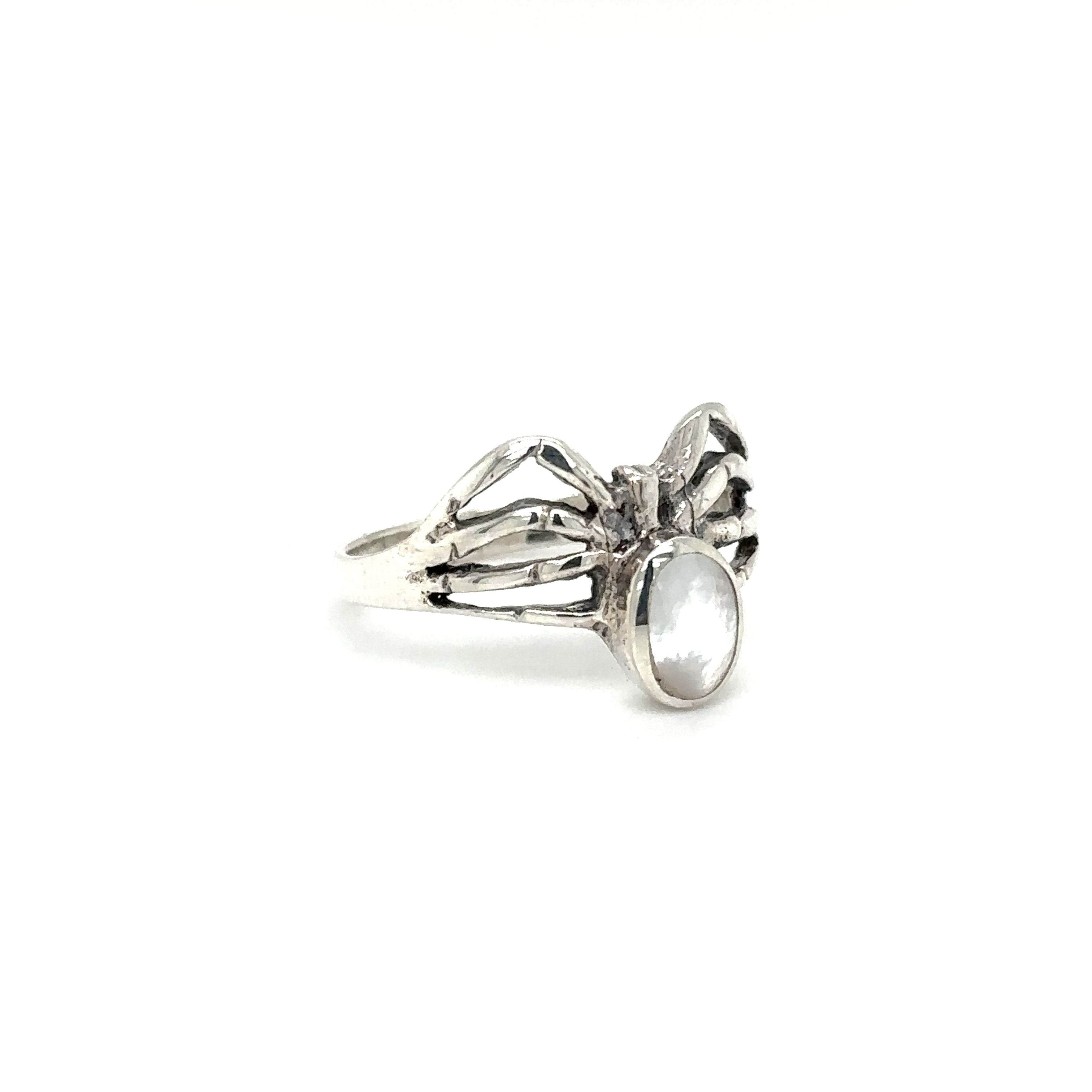 A mystical Super Silver ring with enchanting wings and a captivating Inlay Stone Spider.