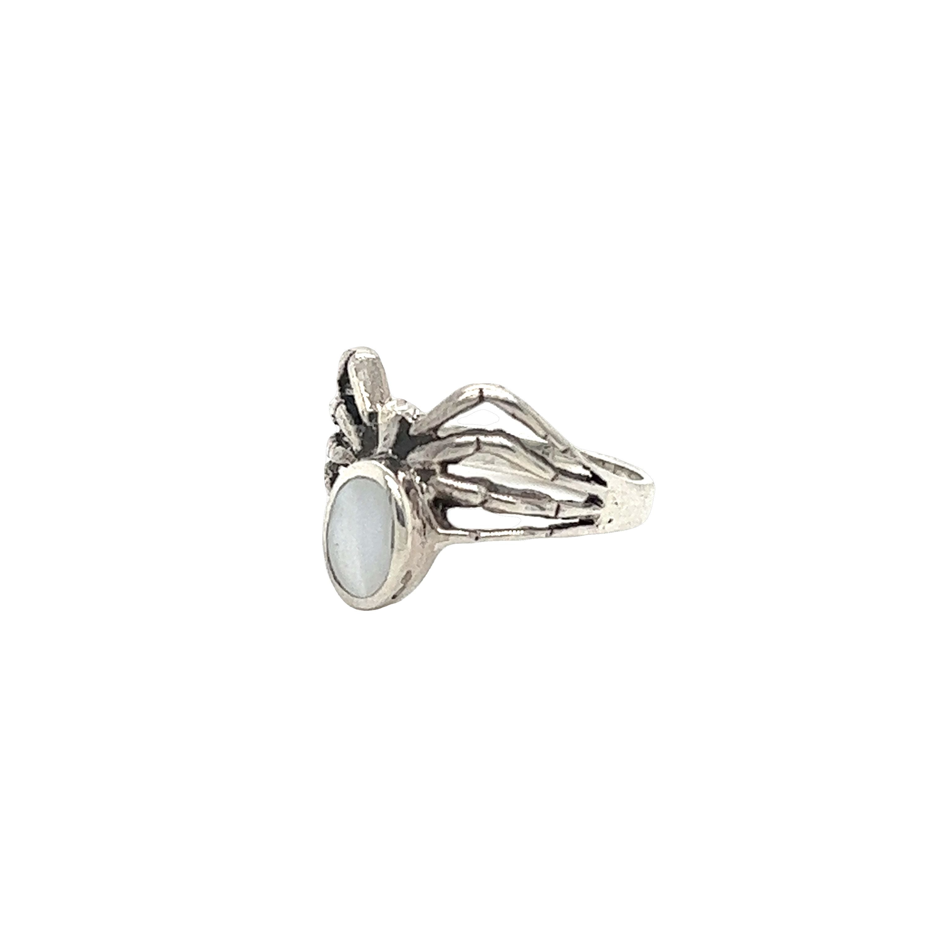 A mystical Super Silver Inlay Stone Spider Ring with a white stone in the middle.