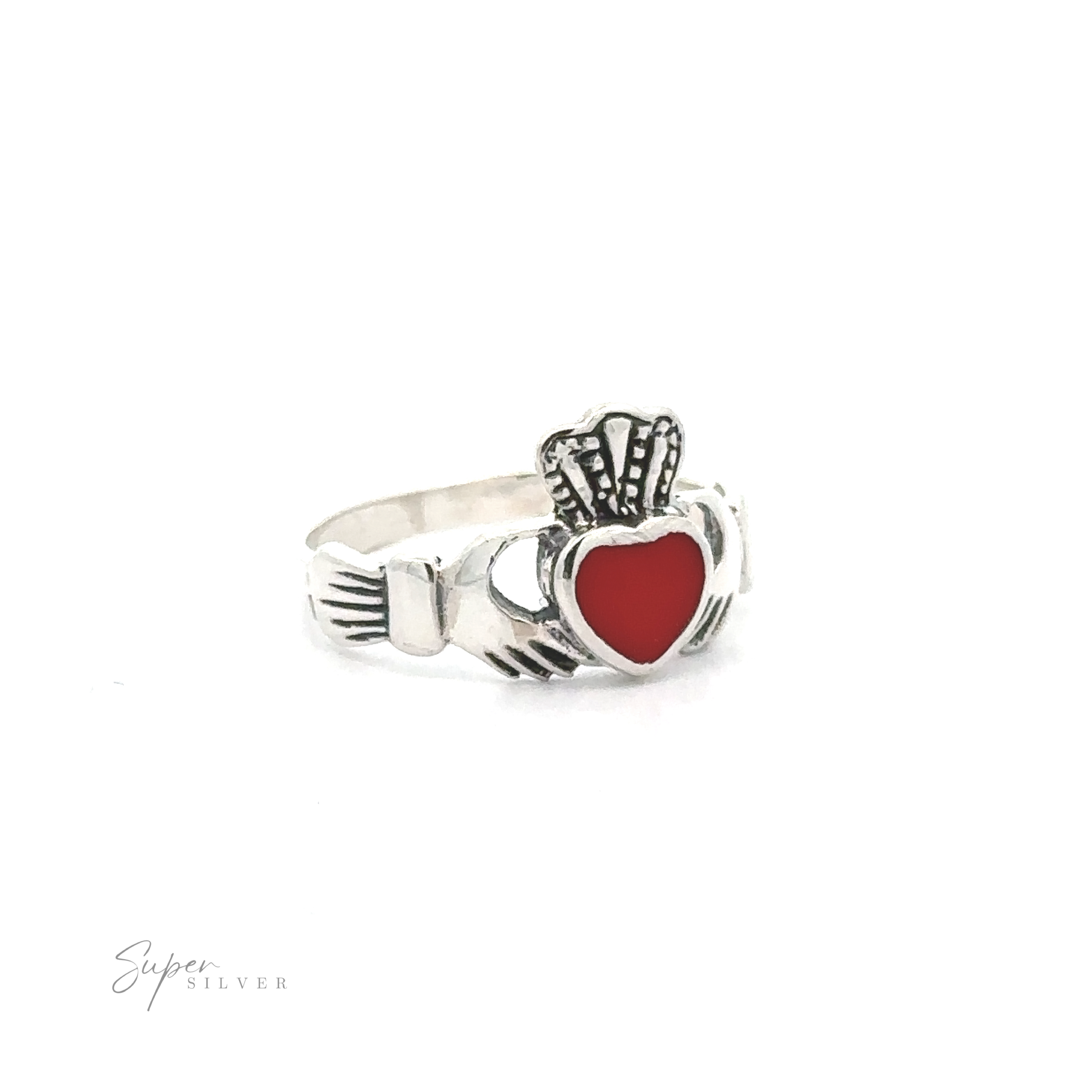 Claddagh Inlaid Stone ring, representing Irish heritage, featuring a heart-shaped red gem flanked by hands and a crown, set against a white background.