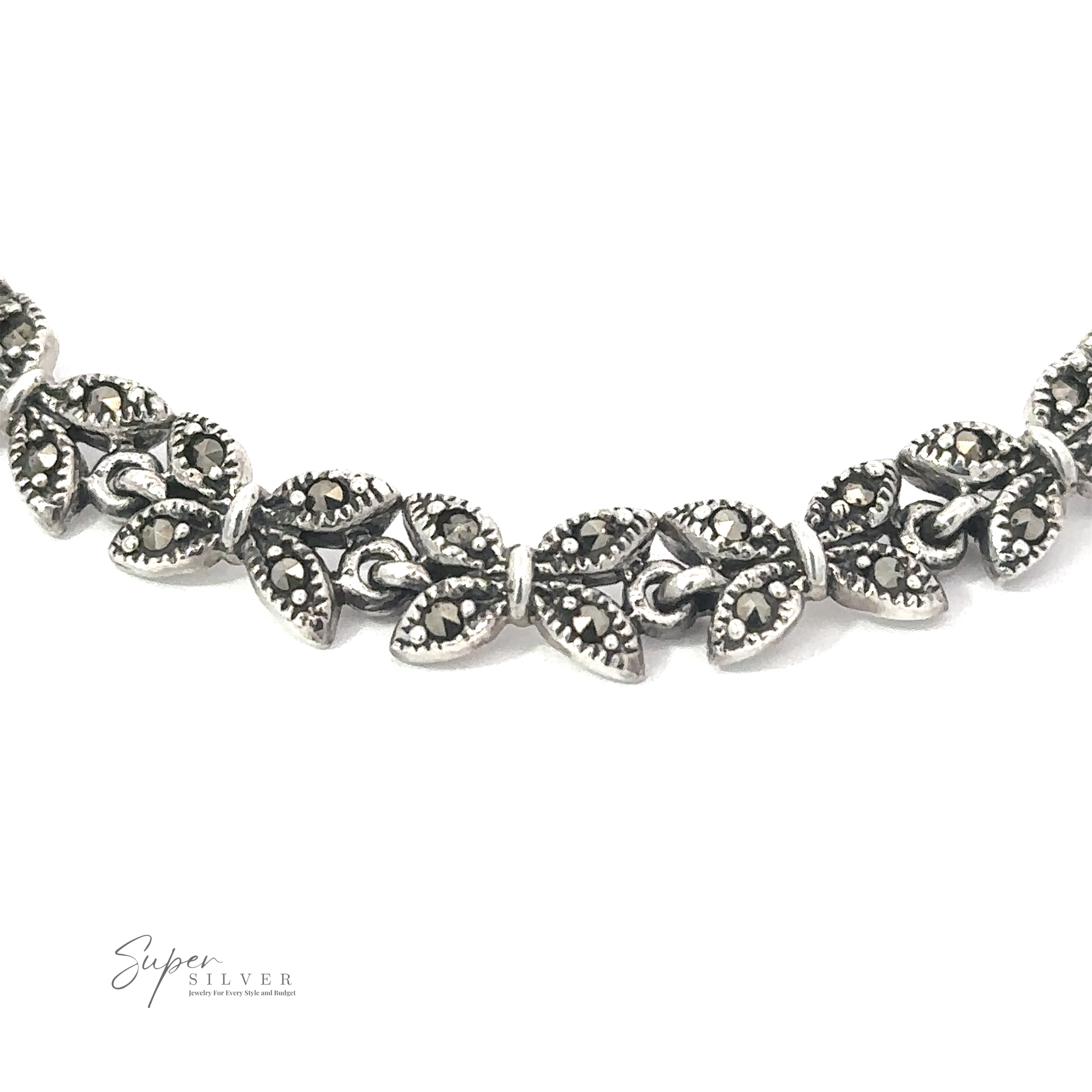 Close-up of a silver necklace intricately designed with connected leaf-shaped links, reminiscent of the Art Deco era. The "Marcasite Butterfly Bracelet" logo is visible in the bottom left corner, adding to its charm. This piece pairs beautifully with our Marcasite Butterfly Bracelet for a complete look.